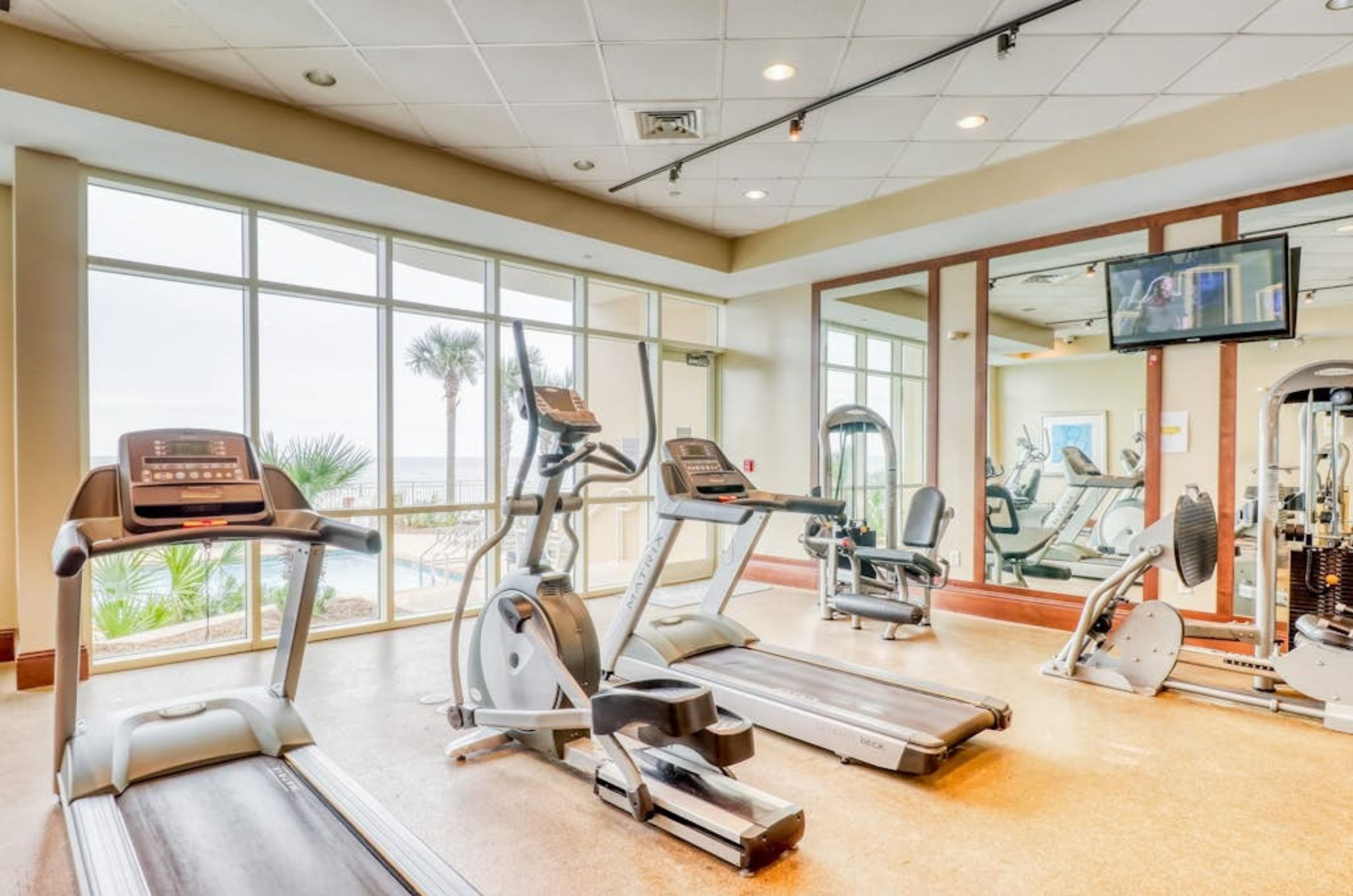 Equipment next to windows in the gym at Aqua Resort in Panama City Beach Florida 