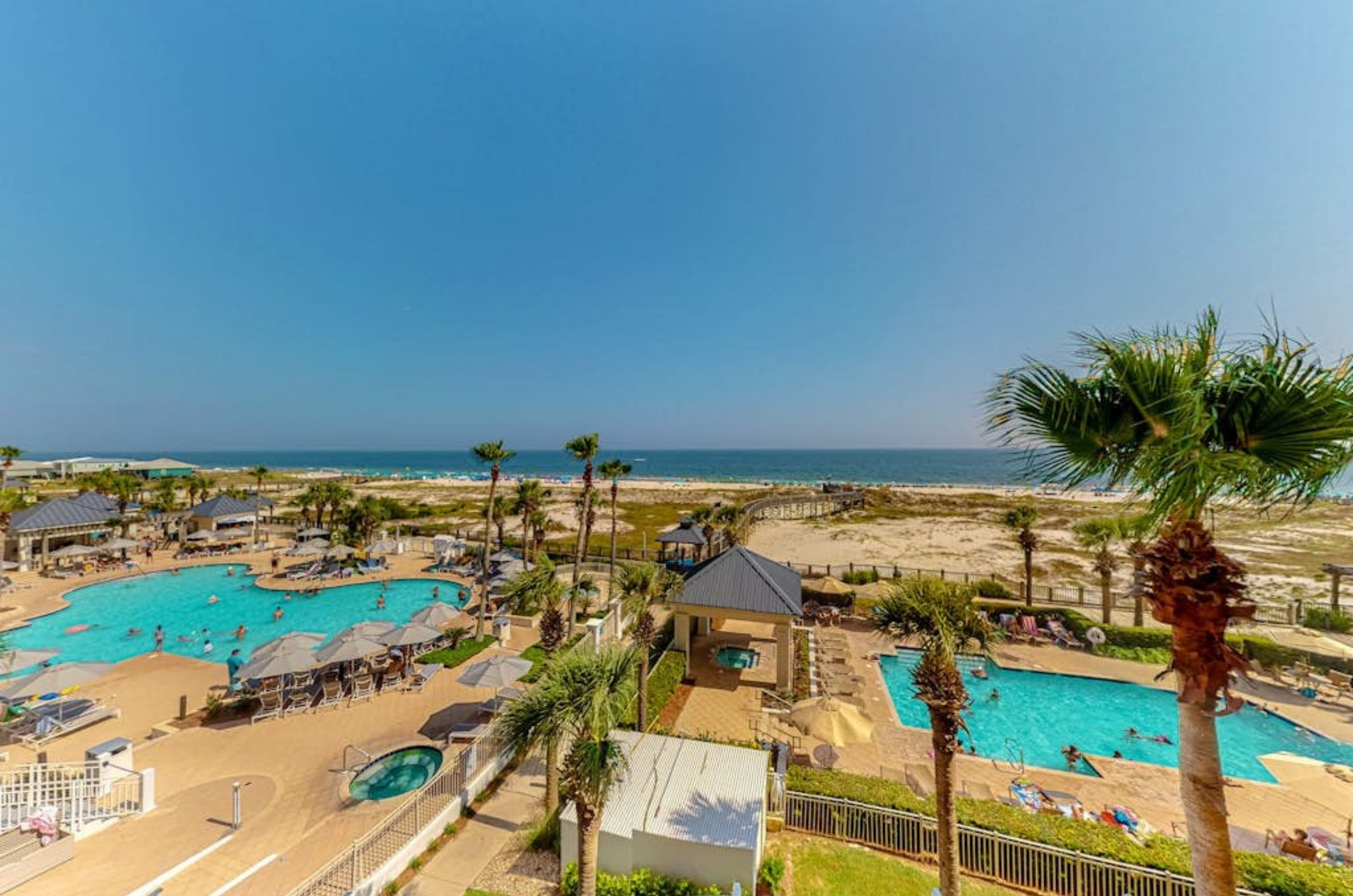 View from a balcony of the outdoor pools and the Gulf of Mexico