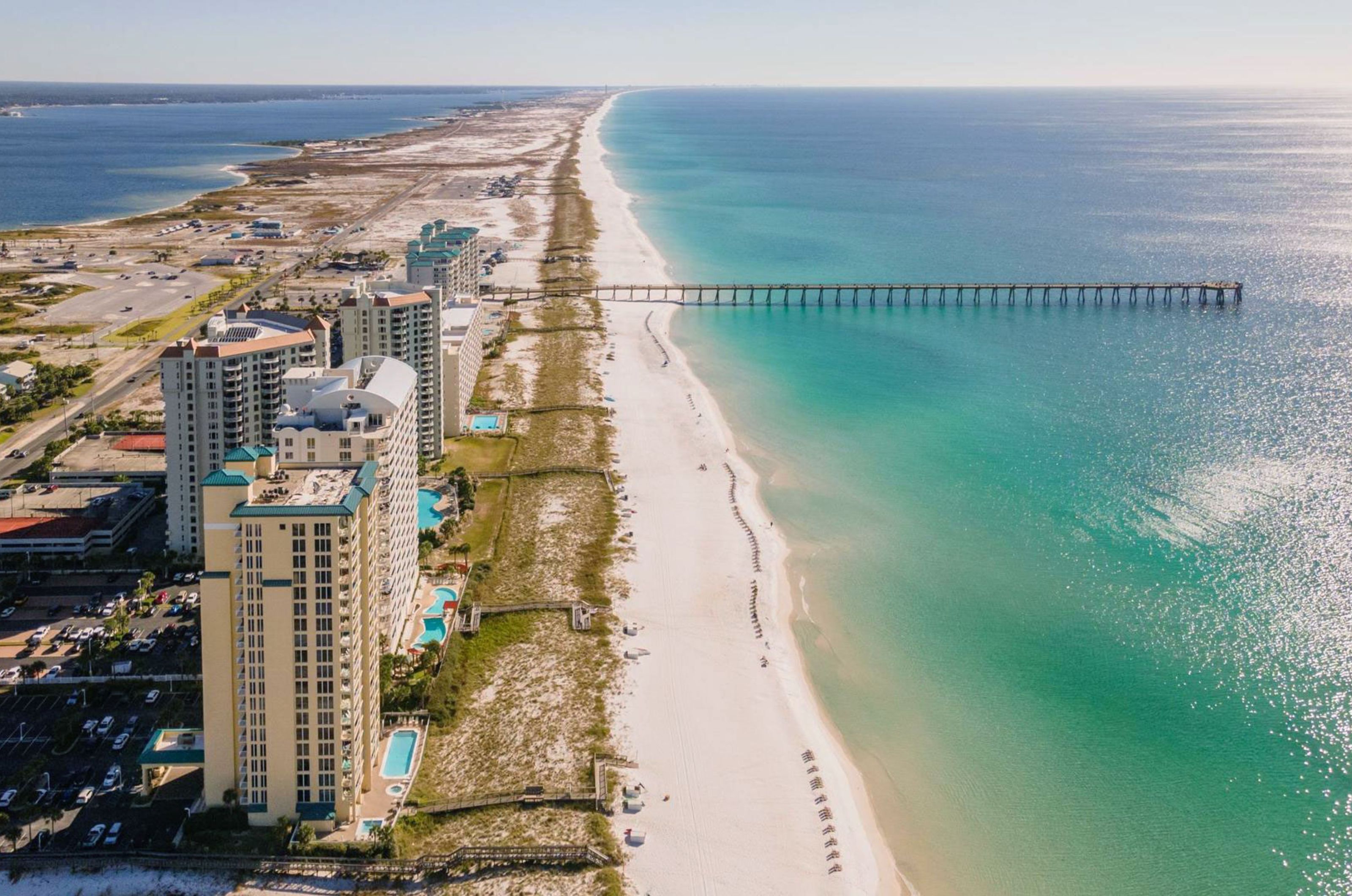 Aerial view of condiminiums and resorts next to Navarre Beach and the Gulf of Mexico