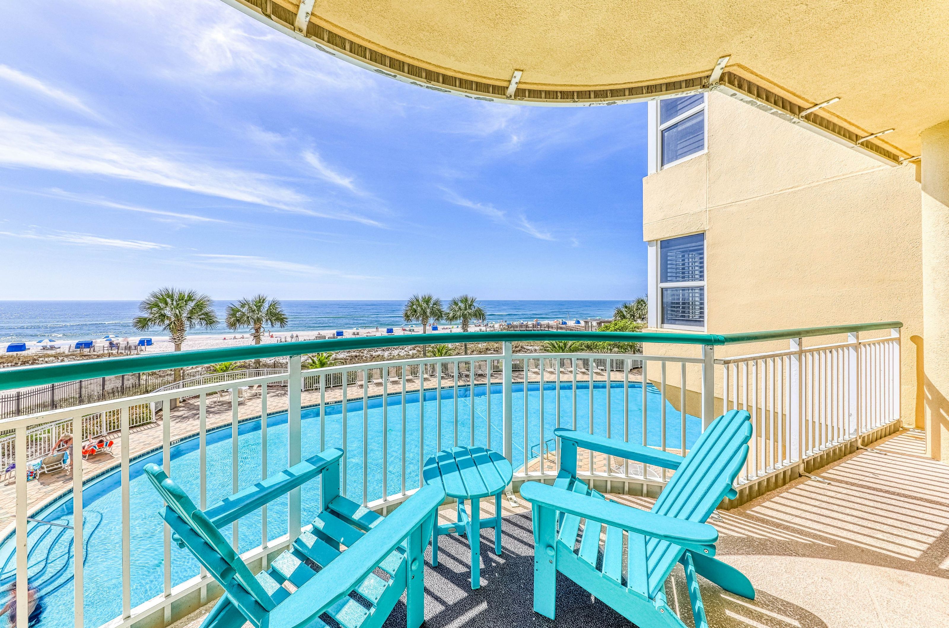 View of the outdoor pool and Gulf of Mexico from a balcony 