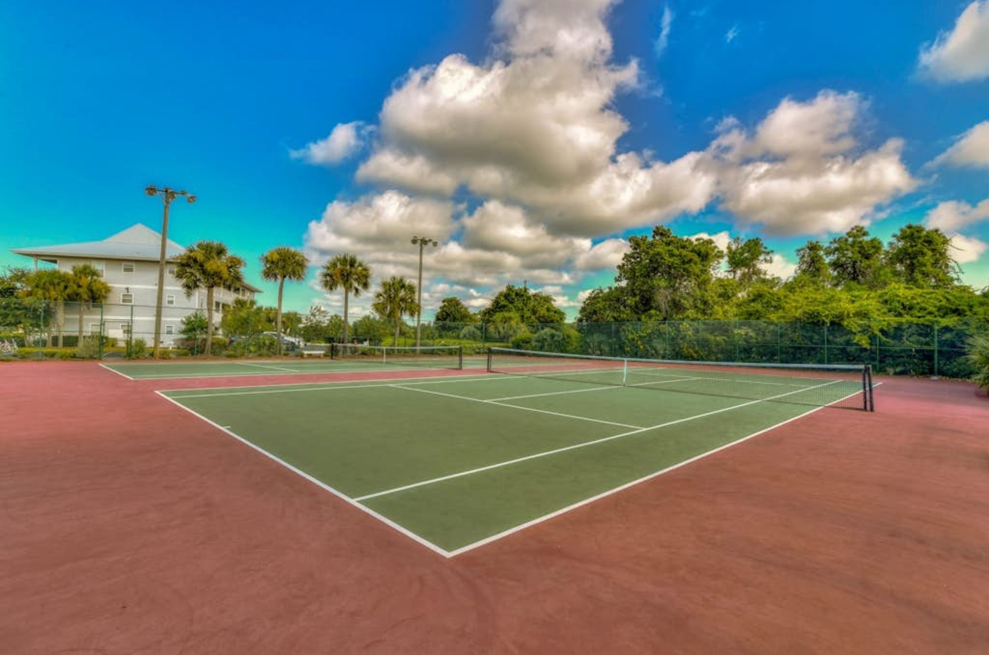 The outdoor lighted tennis courts at Beachside Villas on Highway 30A