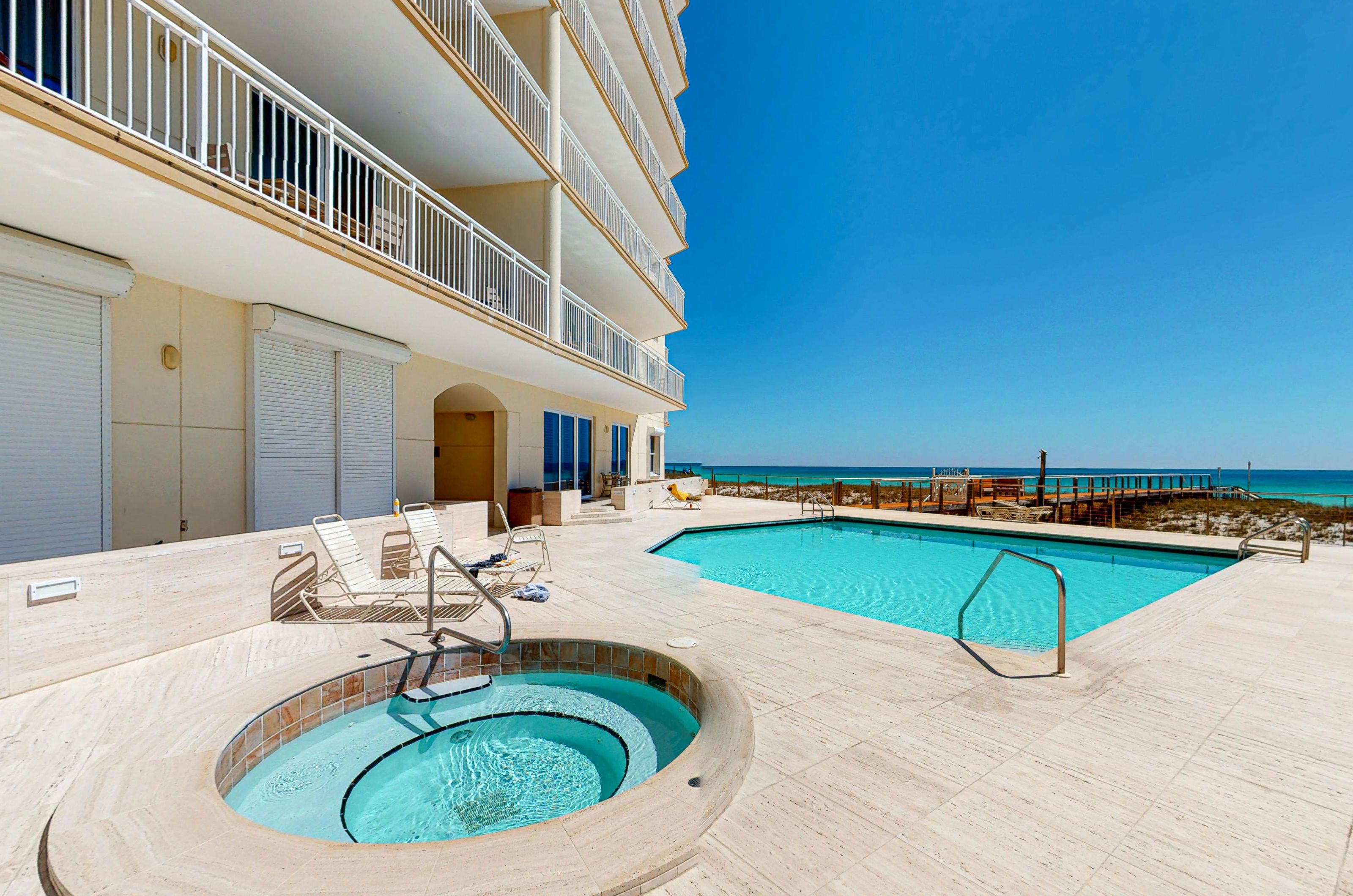 Beachside outdoor pool and hot tub at Belle Mer