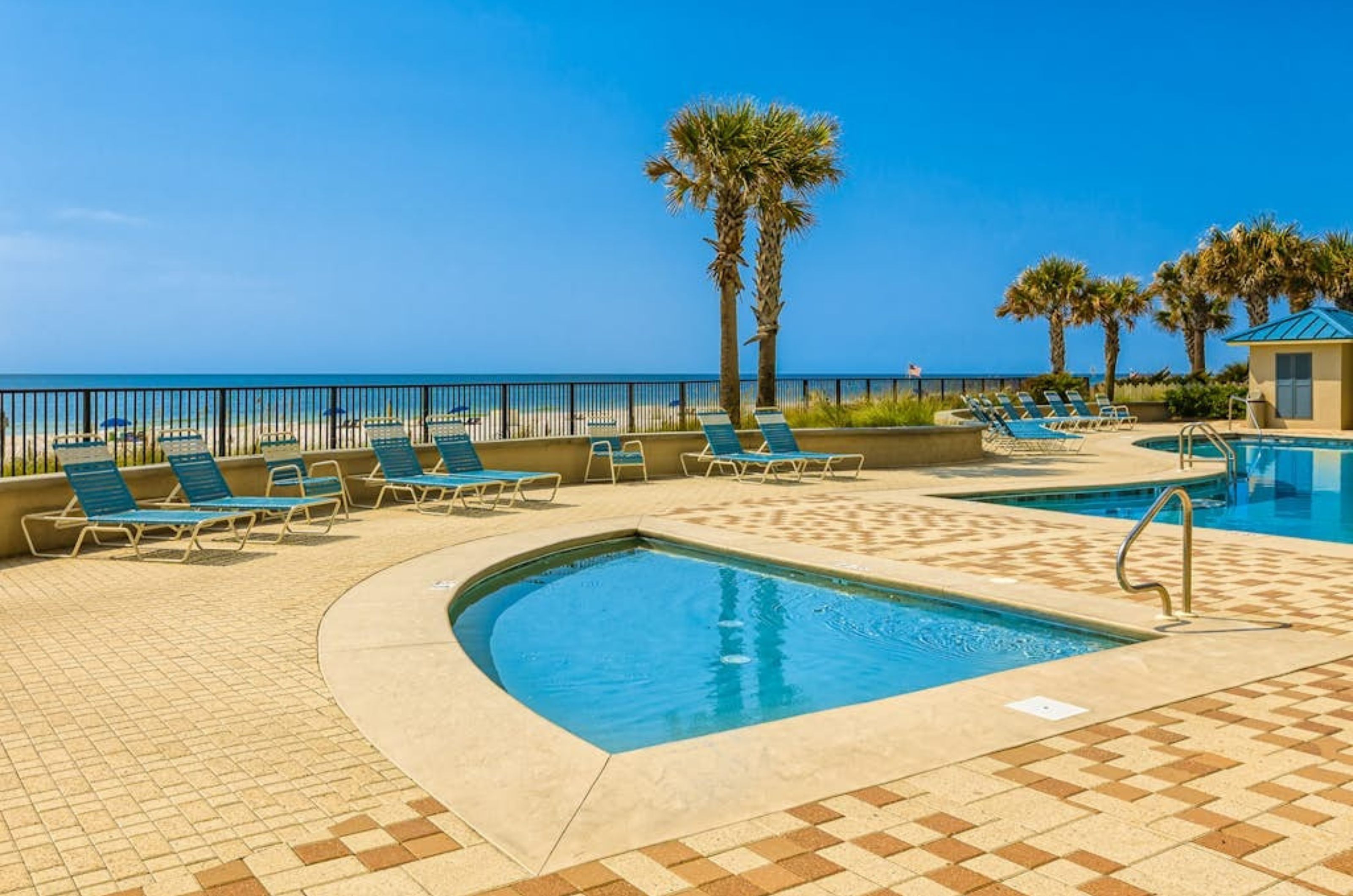 The beachside kiddie pool and surrounding lounge chairs at Bluewater Condominiums