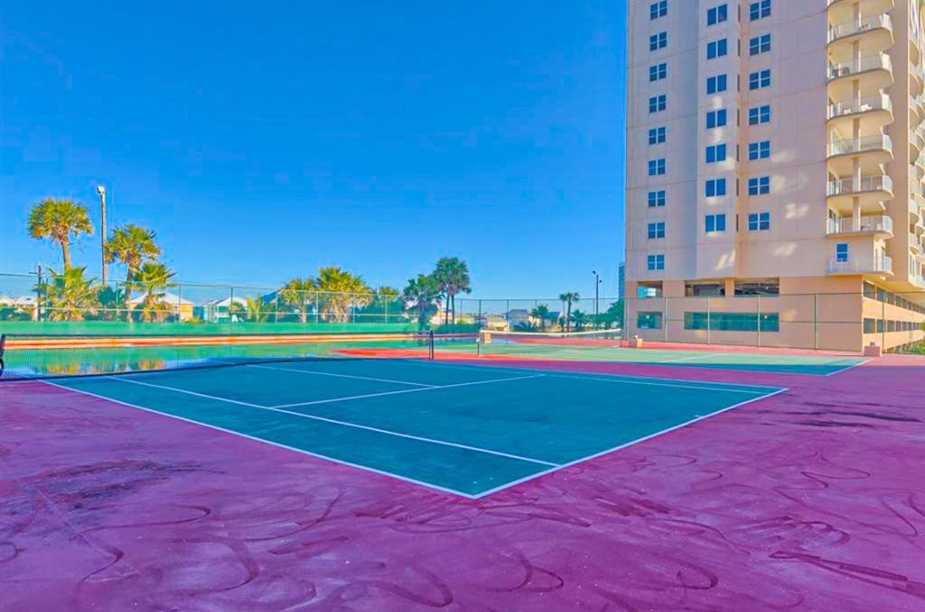 The outdoor tennis courts next to the exterior of Broadmoor