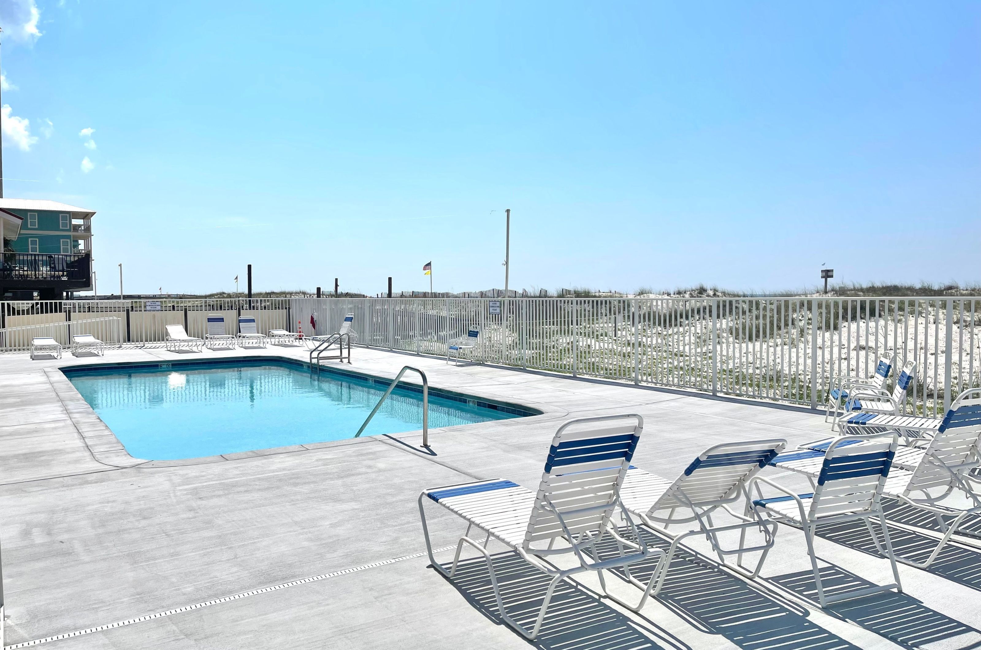 The beachside outdoor pool and lounge chairs at Buena Vista