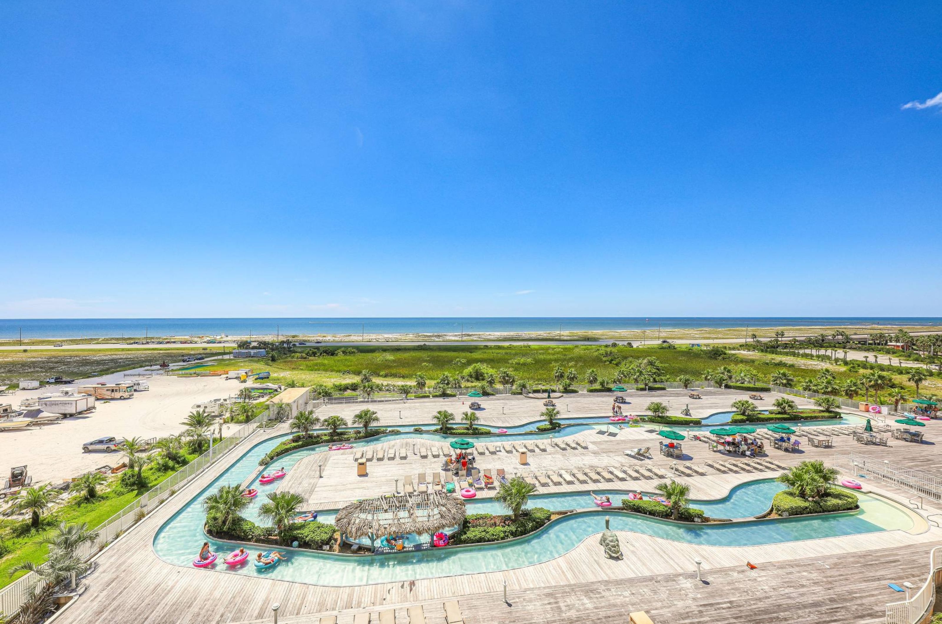 View from a private balcony of the outdoor lazy river at Caribe Resort in Orange Beach Alabama 