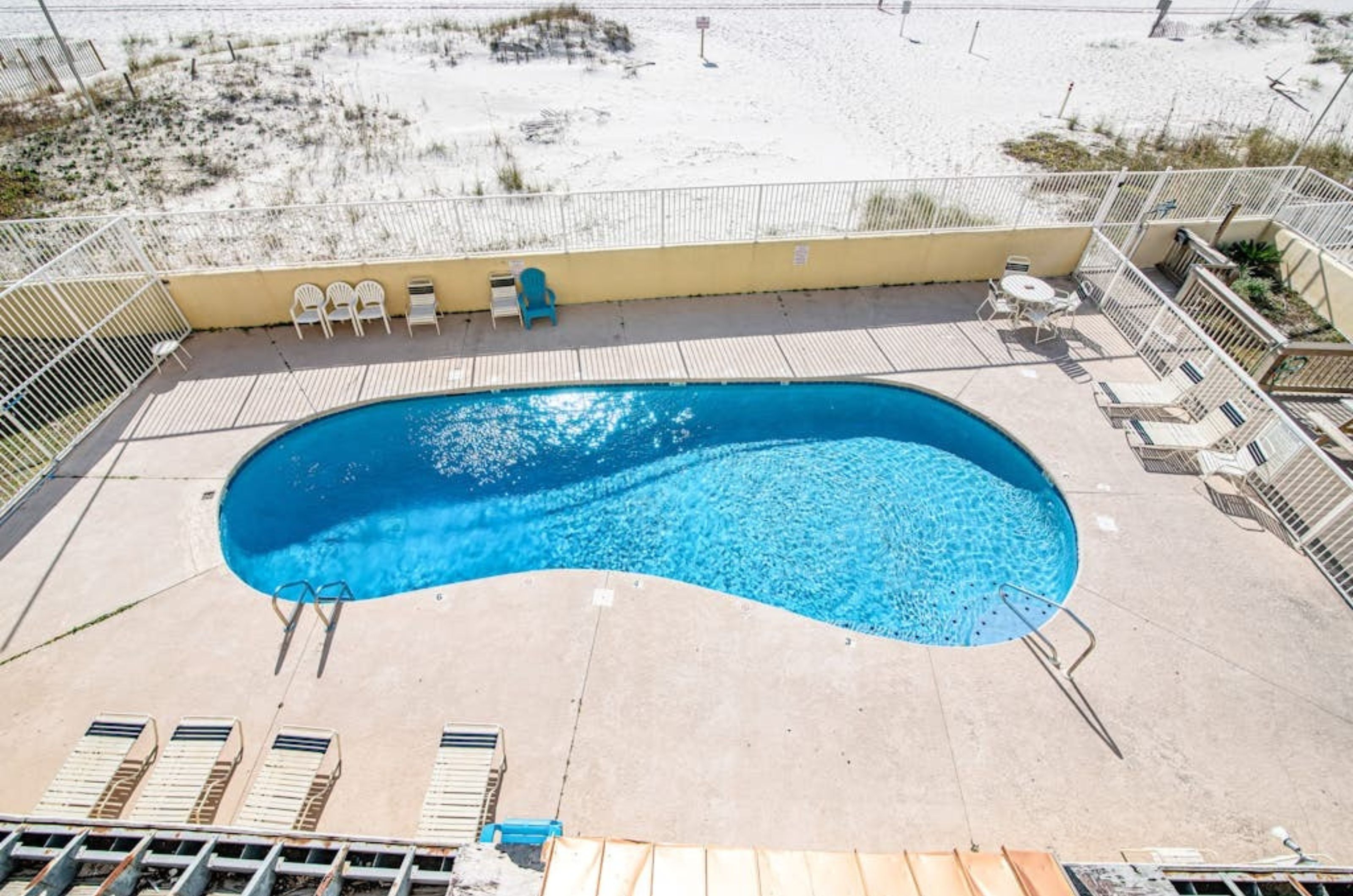 Aerial view of the outdoor swimming pool and pool deck in Gulf Shores Alabama	