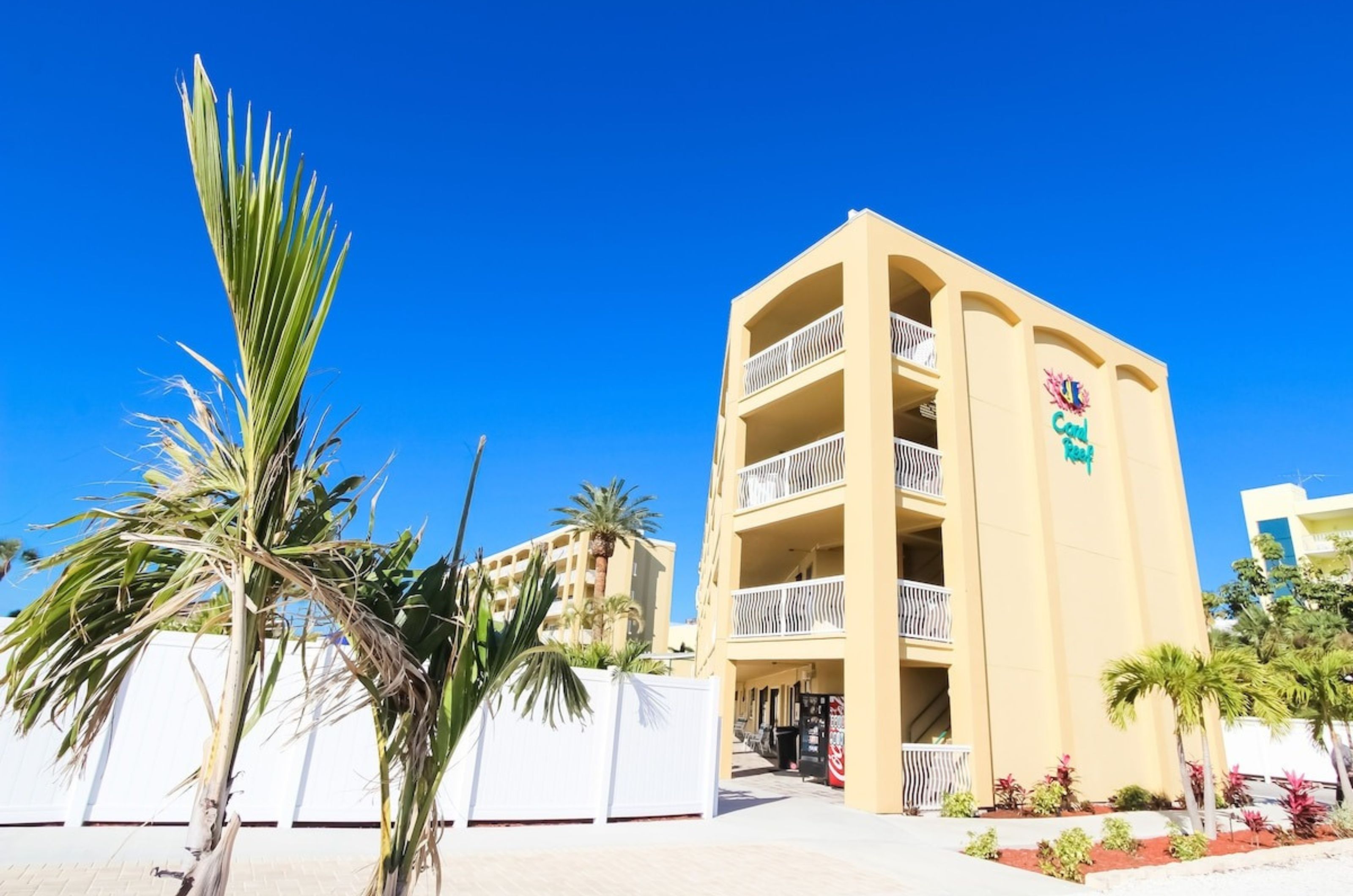 View from the side of the exterior of Coral Reef Beach Resort and the private balconies	