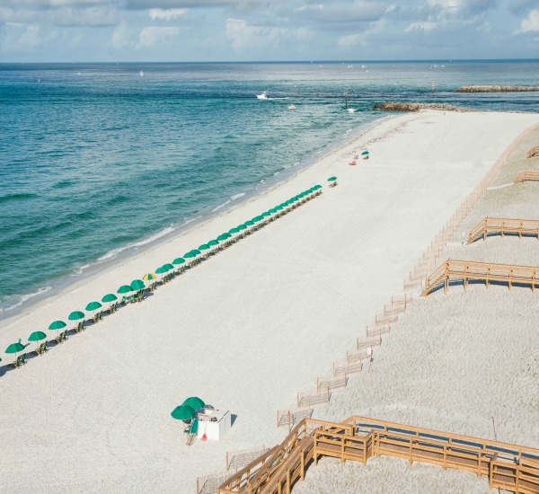 West aerial view of beach in front of Jetty East in Destin Florida