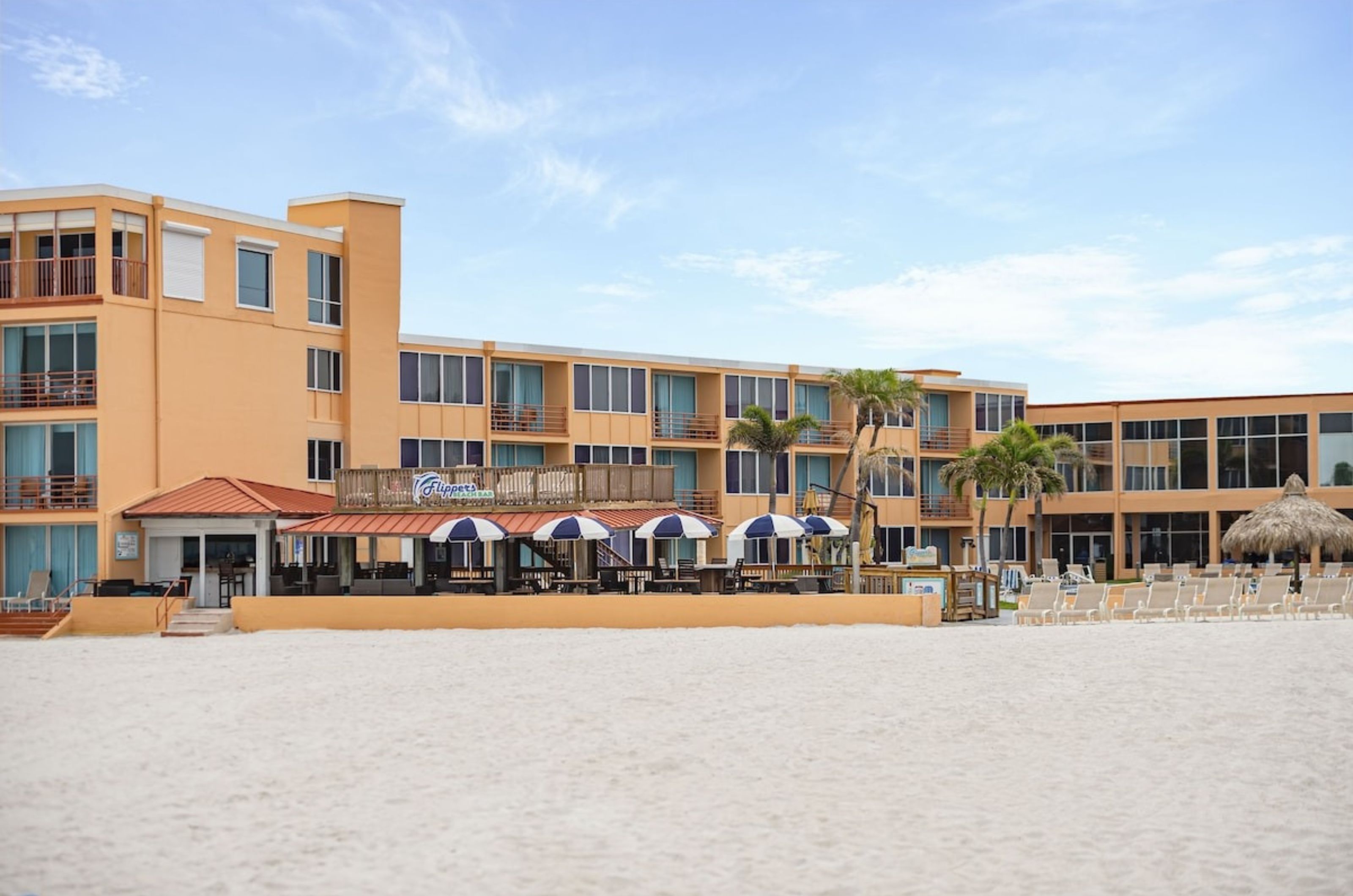 View from the beach of the exterior of Dolphin Beach Resort 