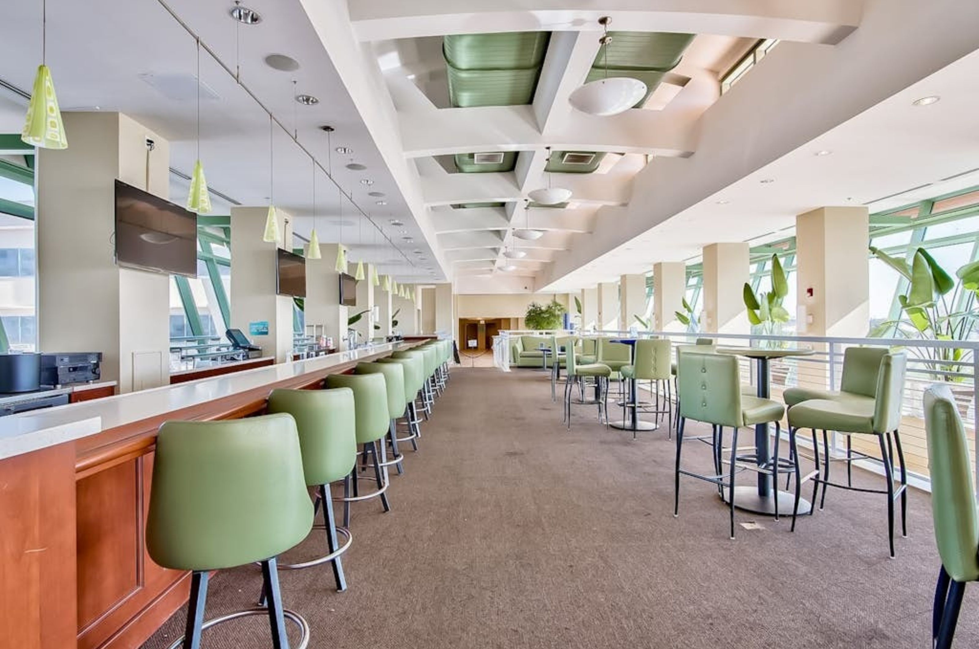 A bar and dining tables in the on-site restaurant at Emerald Beach Resort 