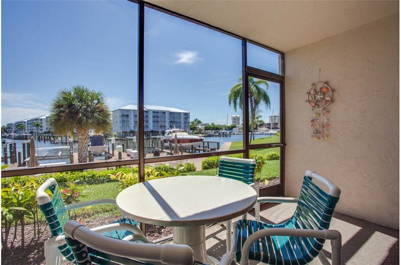 Enjoy view of boats and canal from Estero Yacht & Racquet in Fort Myers Beach Florida