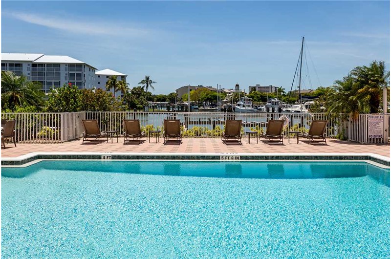 Swim in the pool that is directly on the harbor at Palm Harbor in Fort Myers Beach FL