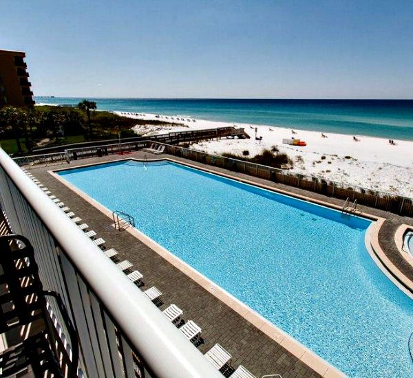 Balcony view of the pool and beach at Waters Edge Condos in Fort Walton FL