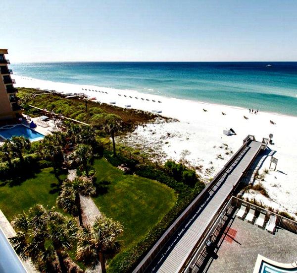 Aerial view of the grounds boardwalk and beach at Waters Edge Condos in Fort Walton FL