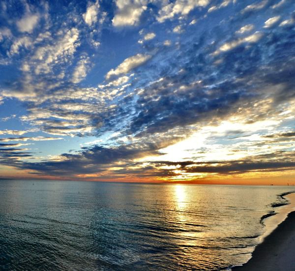 Cloudy sunset over the Gulf at Waters Edge Condos in Fort Walton Florida