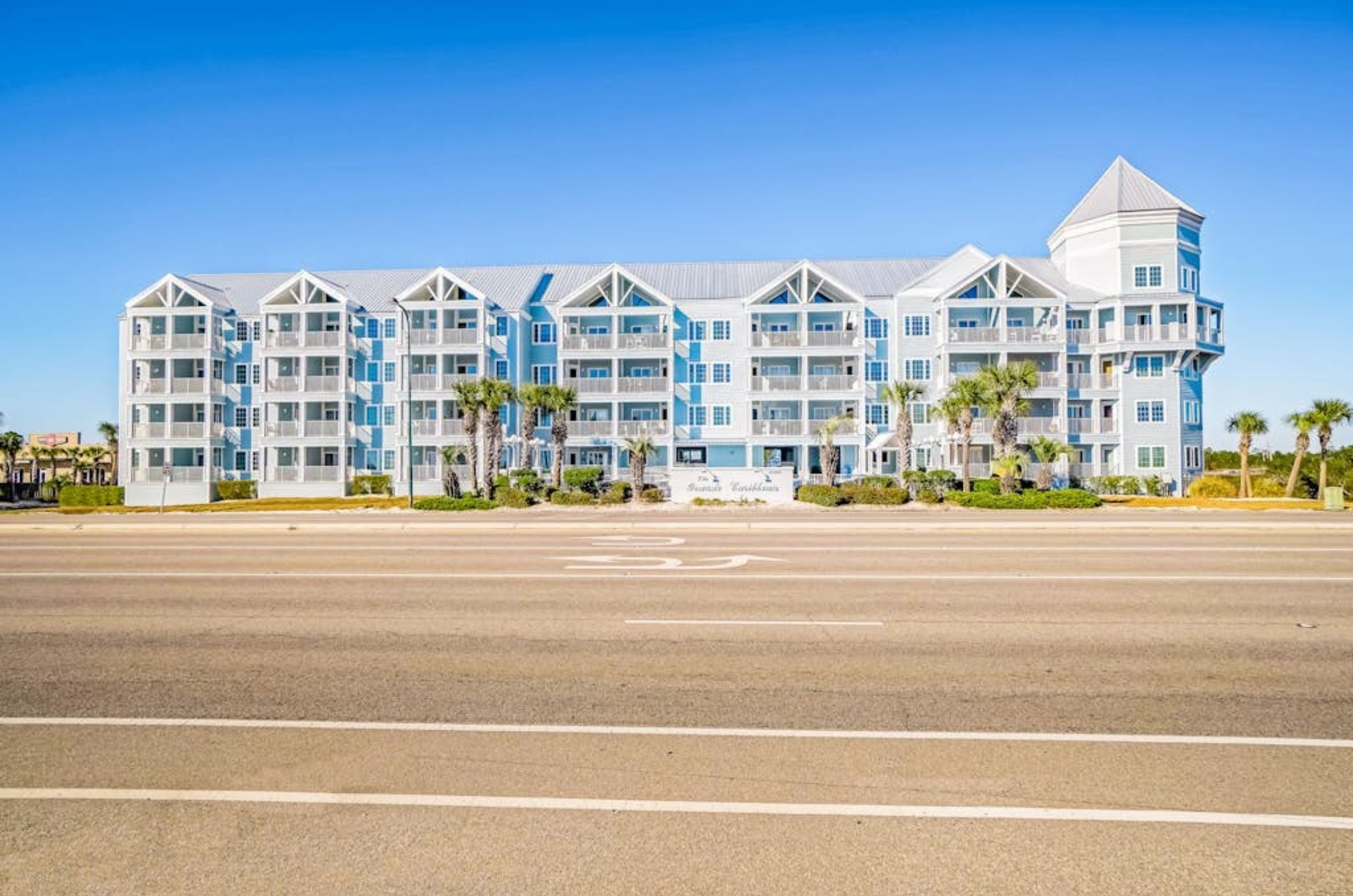 View from the street of the exterior of Grand Caribbean in Orange Beach Alabama 