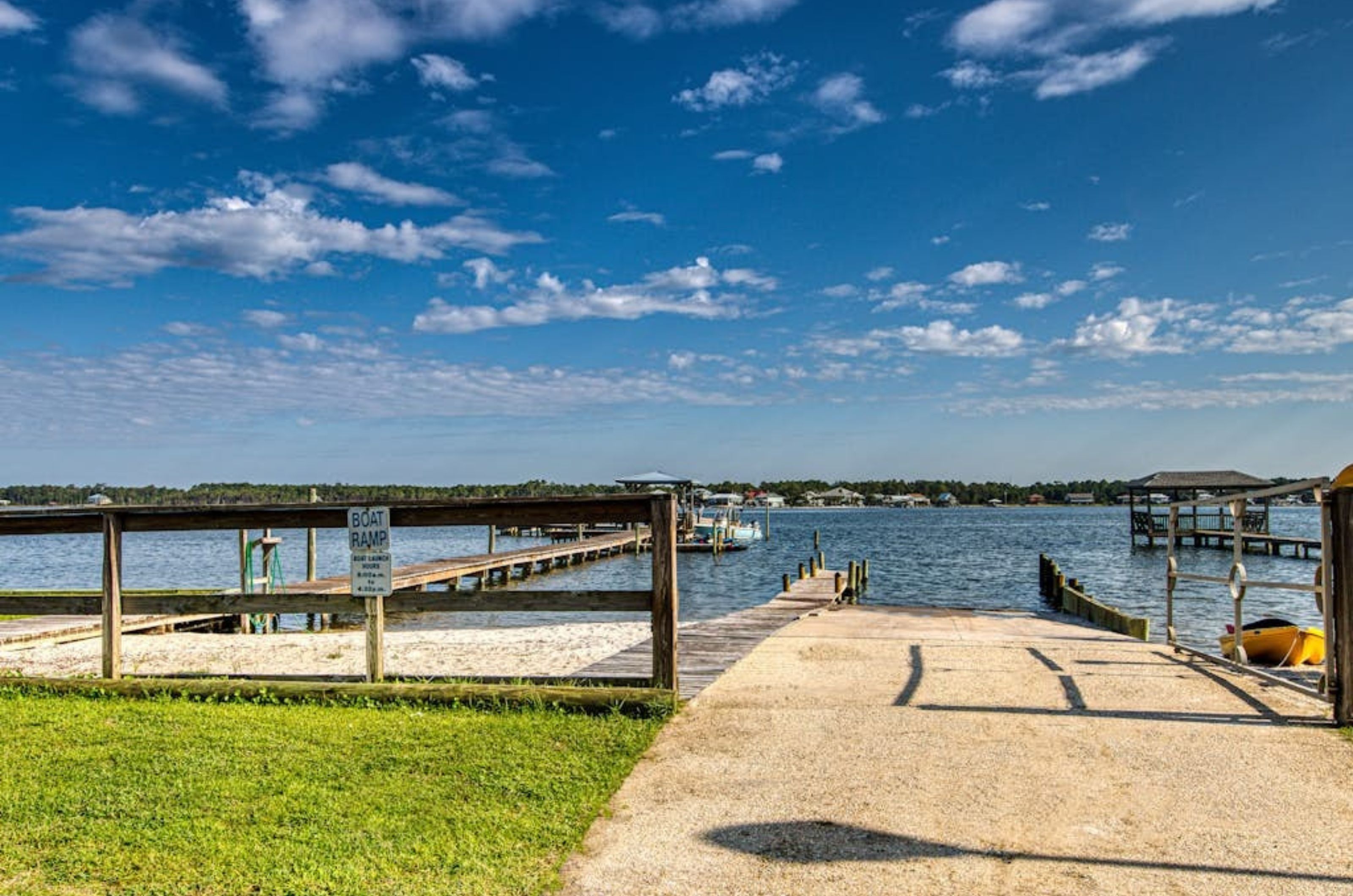 The boat ramp and wooden dock on Little Lagoon at Gulf Shores Surf and Racquet Club in Gulf Shores Alabama 