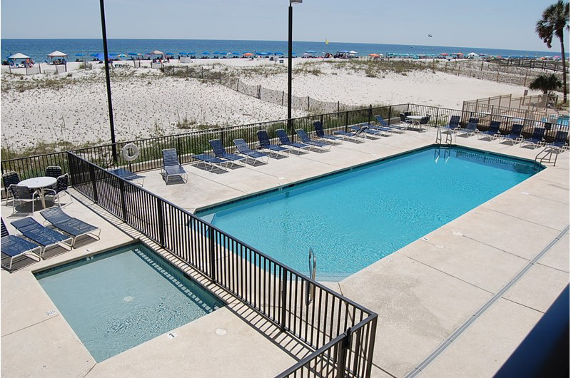 Stay relaxed at the pool and hot tub at Island Winds West in Gulf Shores AL