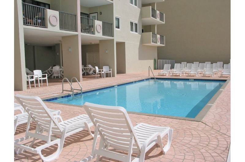 Relax poolside at Tropical Winds Gulf Shores AL.