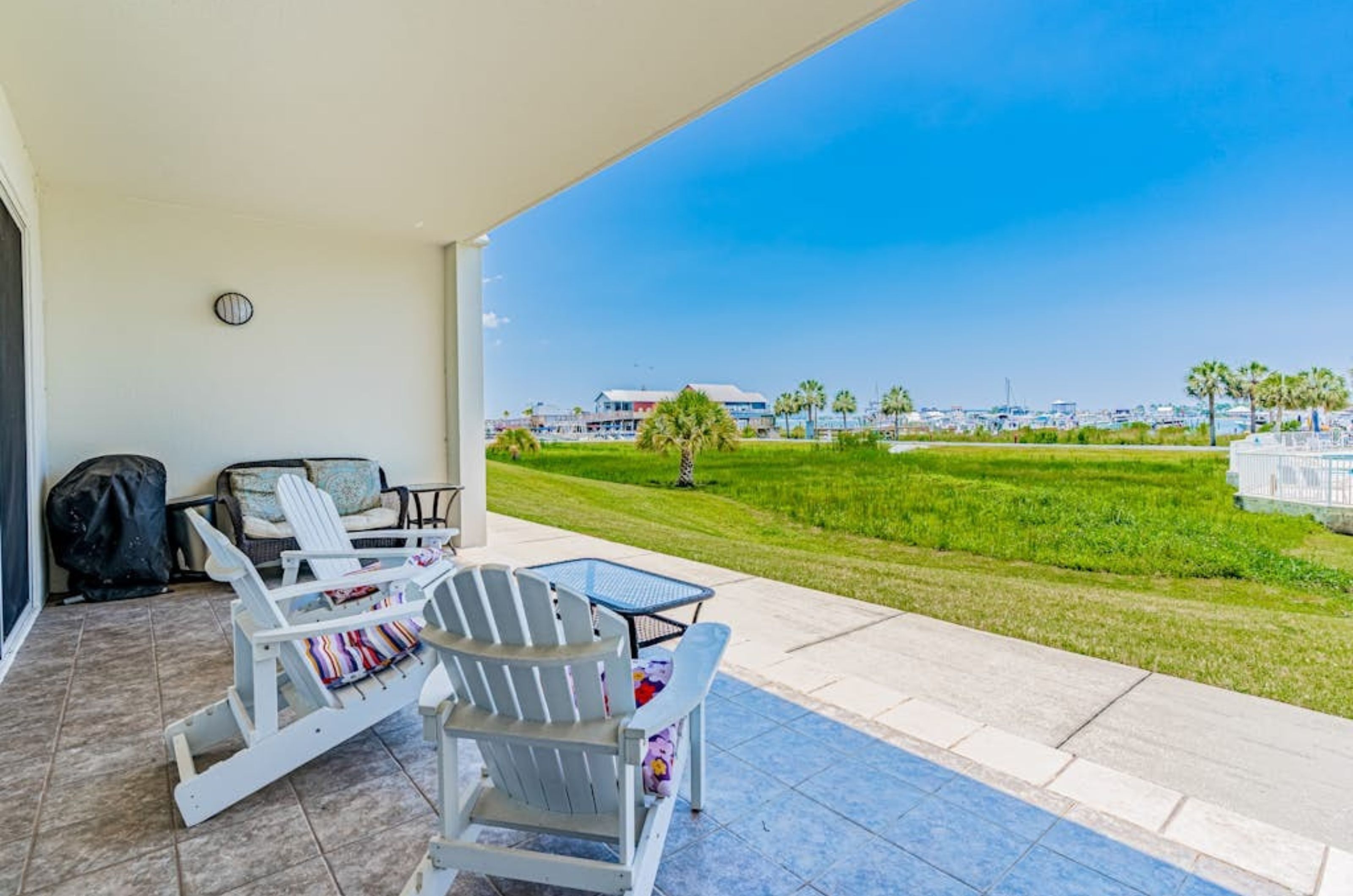 A private balcony with two lounge chairs at Harbor Cove in Orange Beach Alabama 