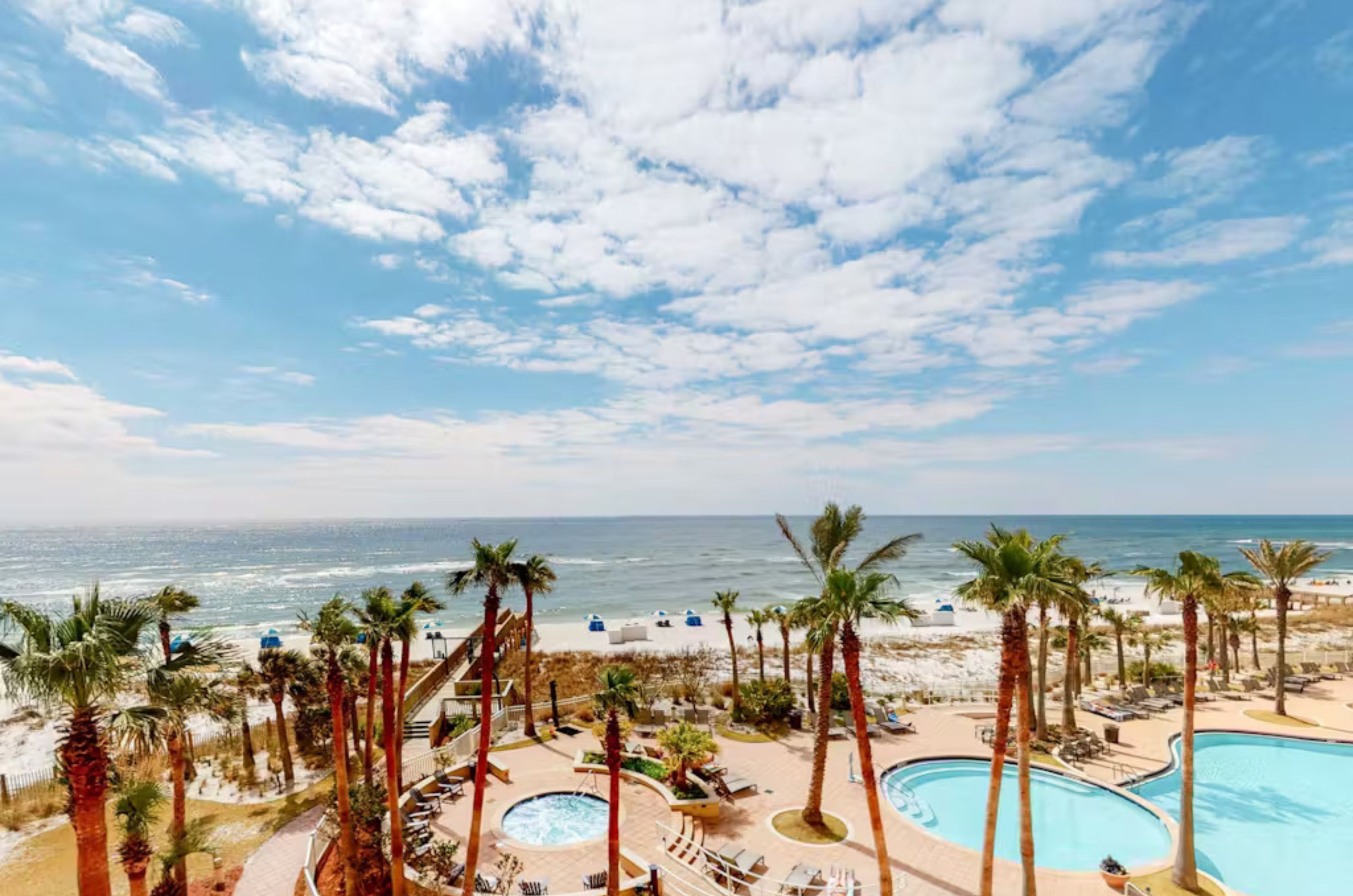 Aerial view of the outdoor hot tub and swimming pool next to the beach