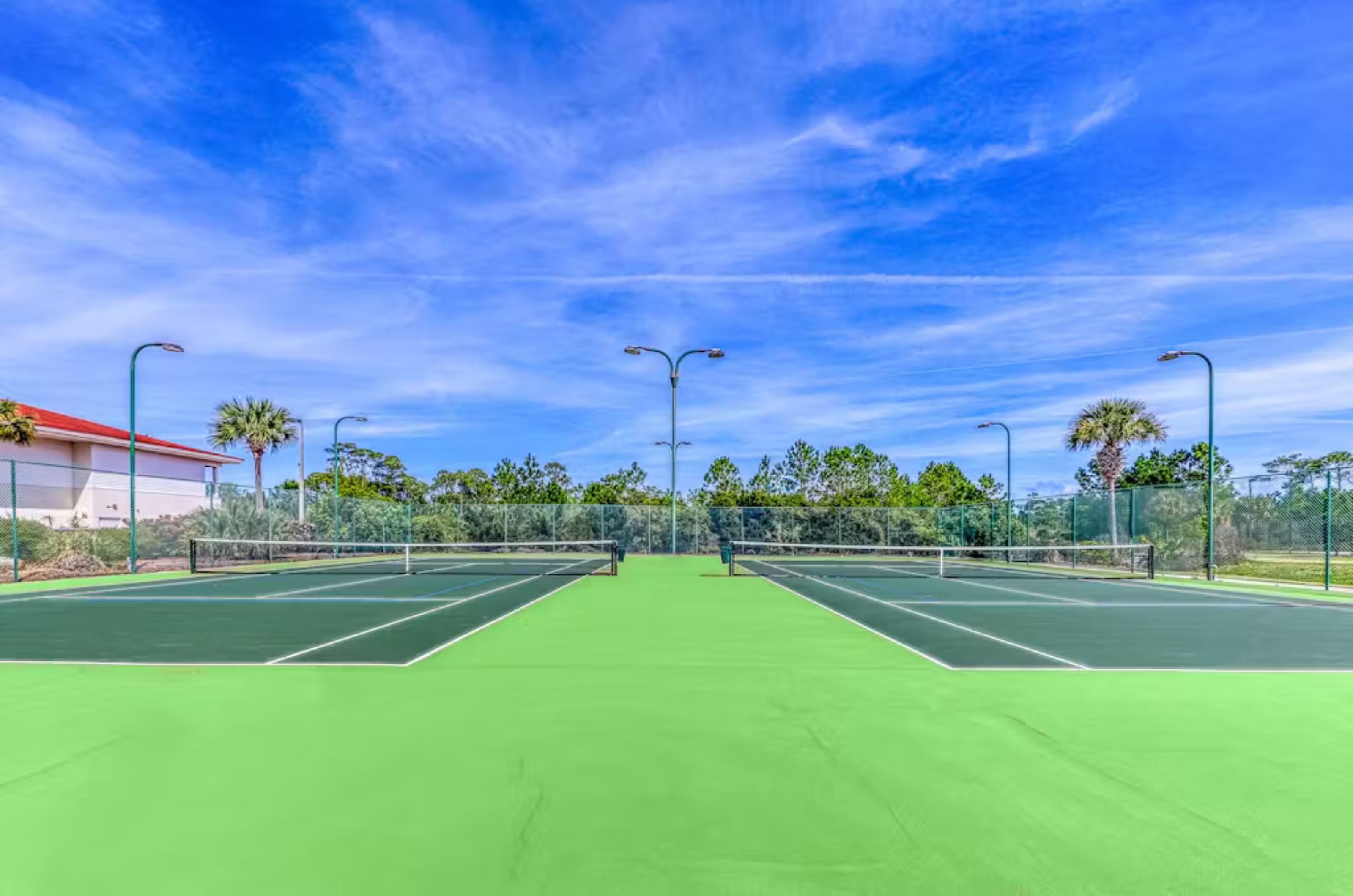 Two outdoor tennis courts at Indigo East and West 