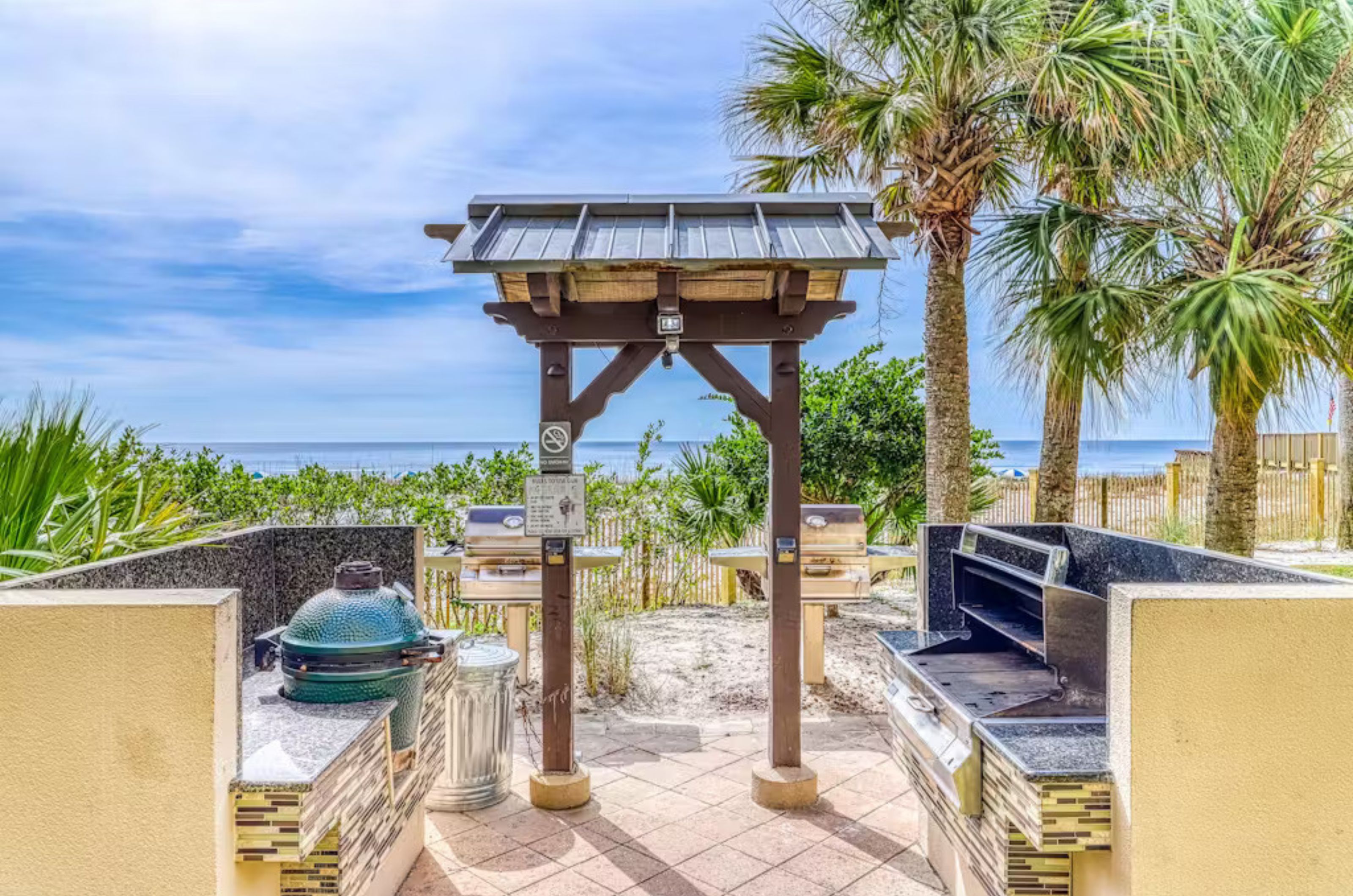 Barbecue grills on a beachside patio 