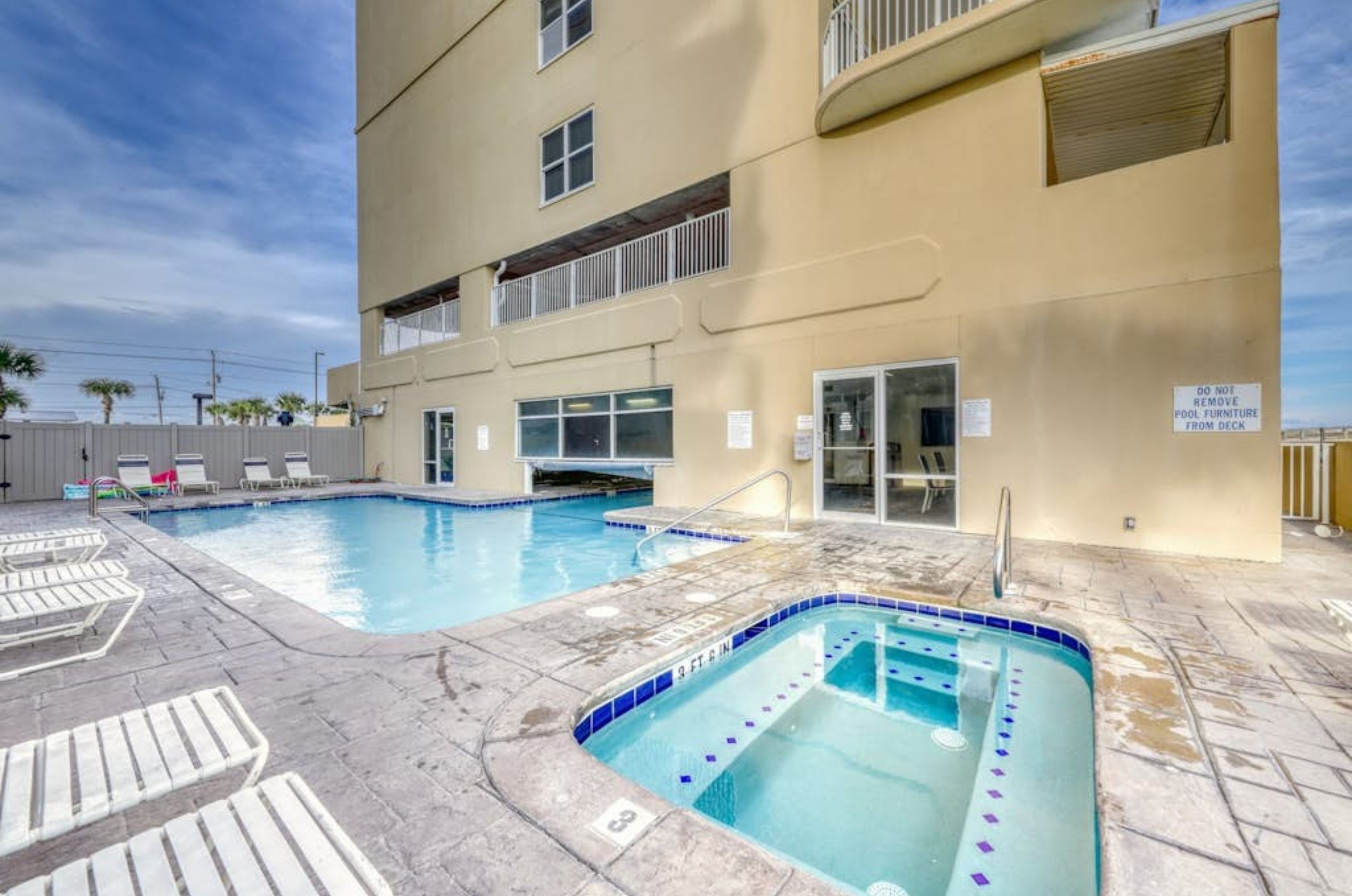 The indoor/outdoor pool and outdoor hot tub in front of Island Royale in Gulf Shores Alabama 