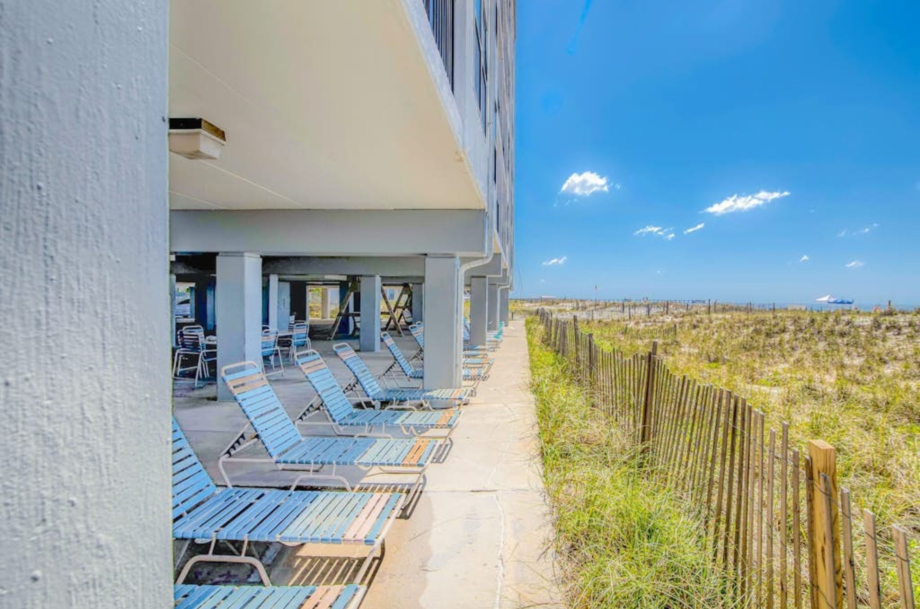 Beachfront chairs under Island Sunrise in Gulf Shores Alabama 