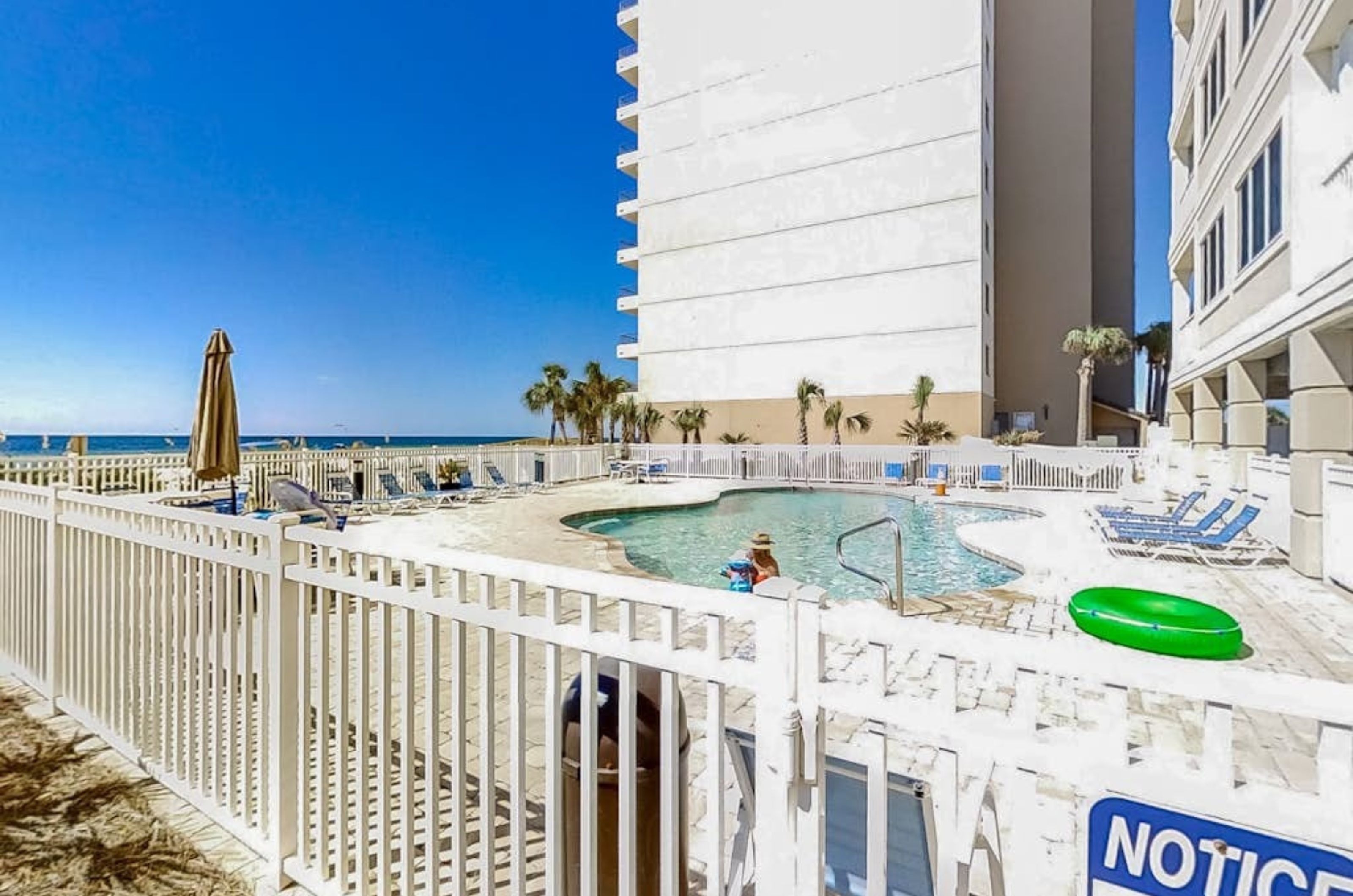 The outdoor swimming pool in front of Marlin Key in Orange Beach Alabama	