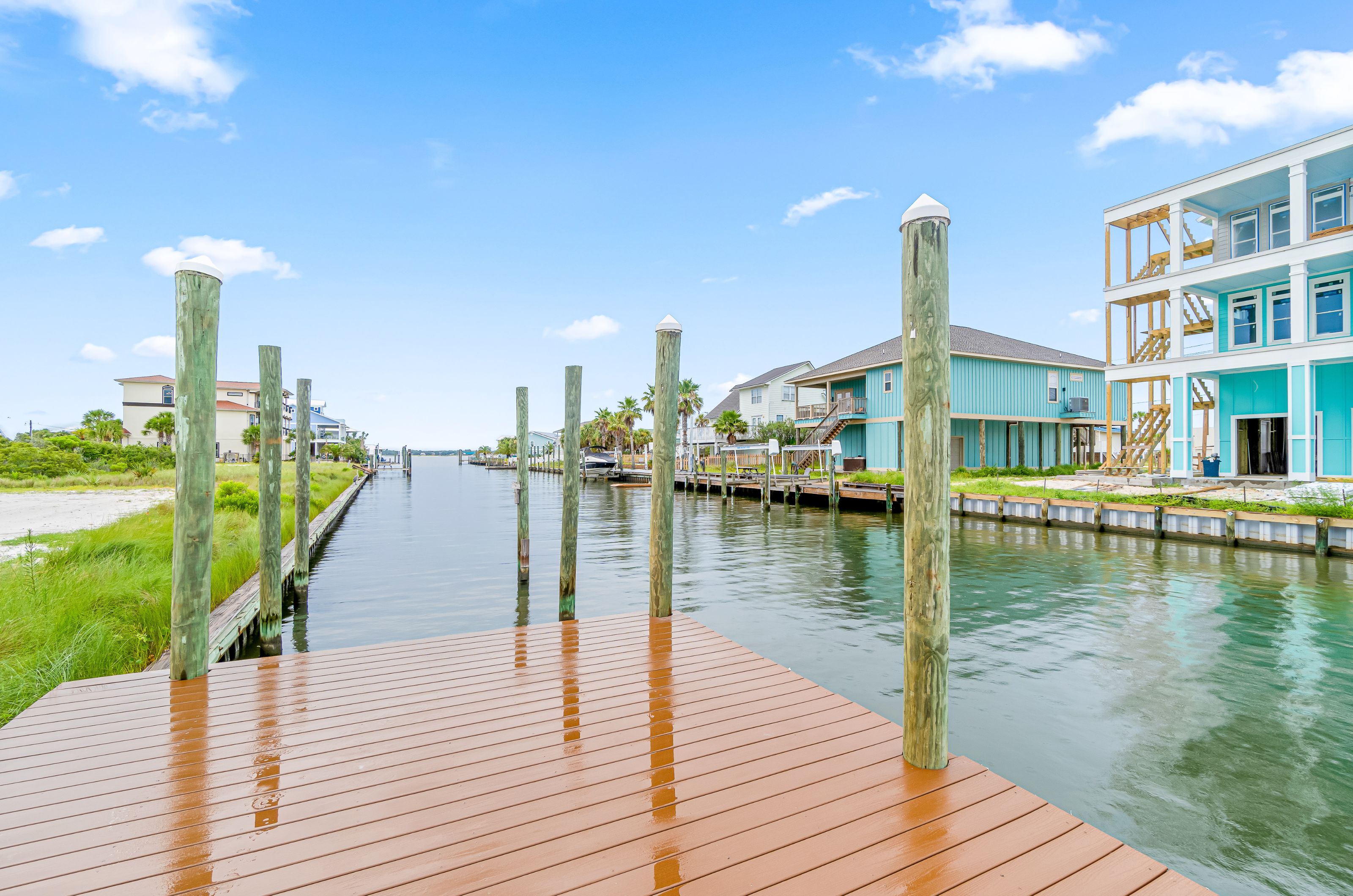 Outdoor deck on a canal running behind houses 