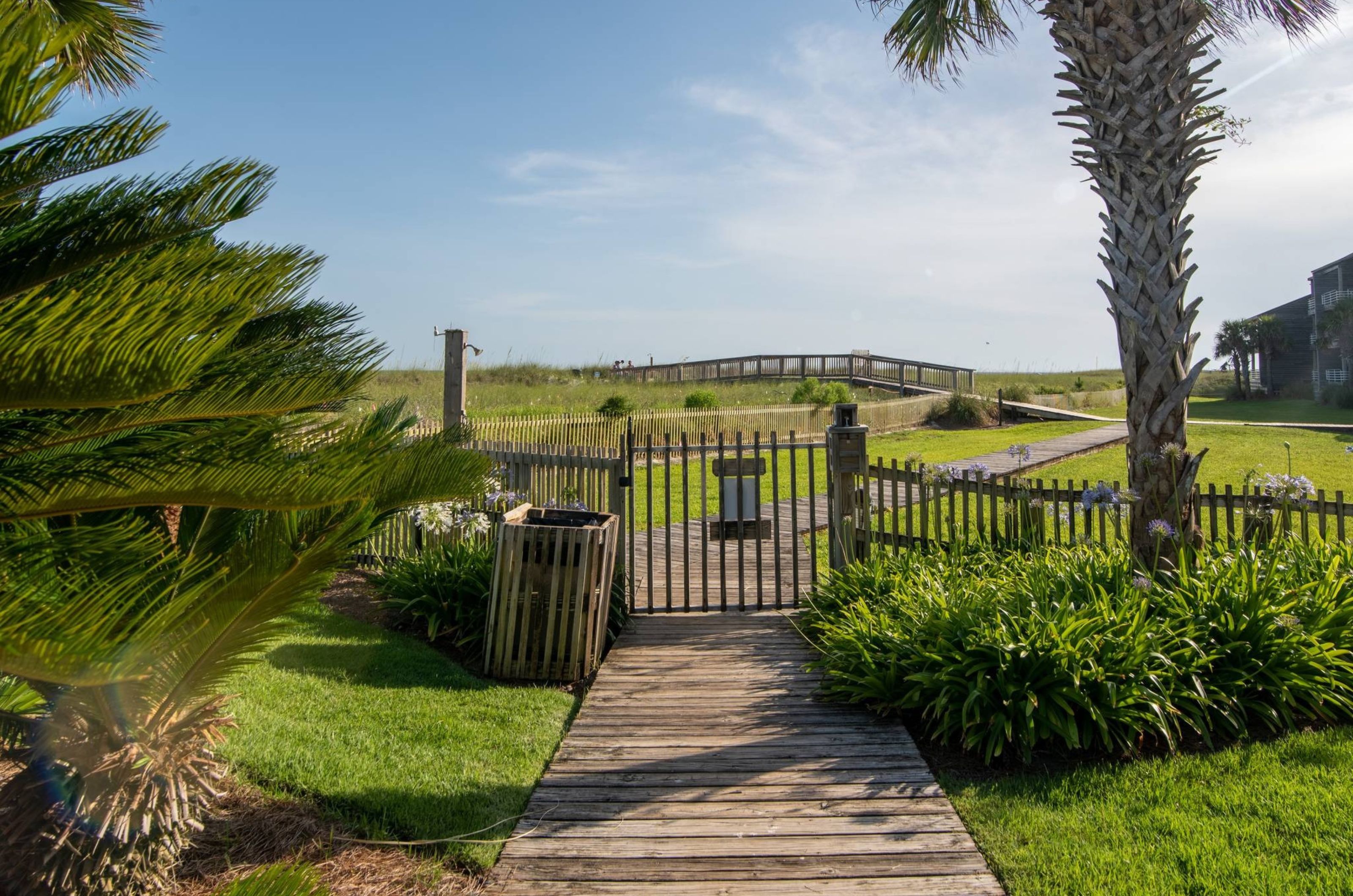 The outdoor shower and gate to the boardwalk at Needle Rush Point