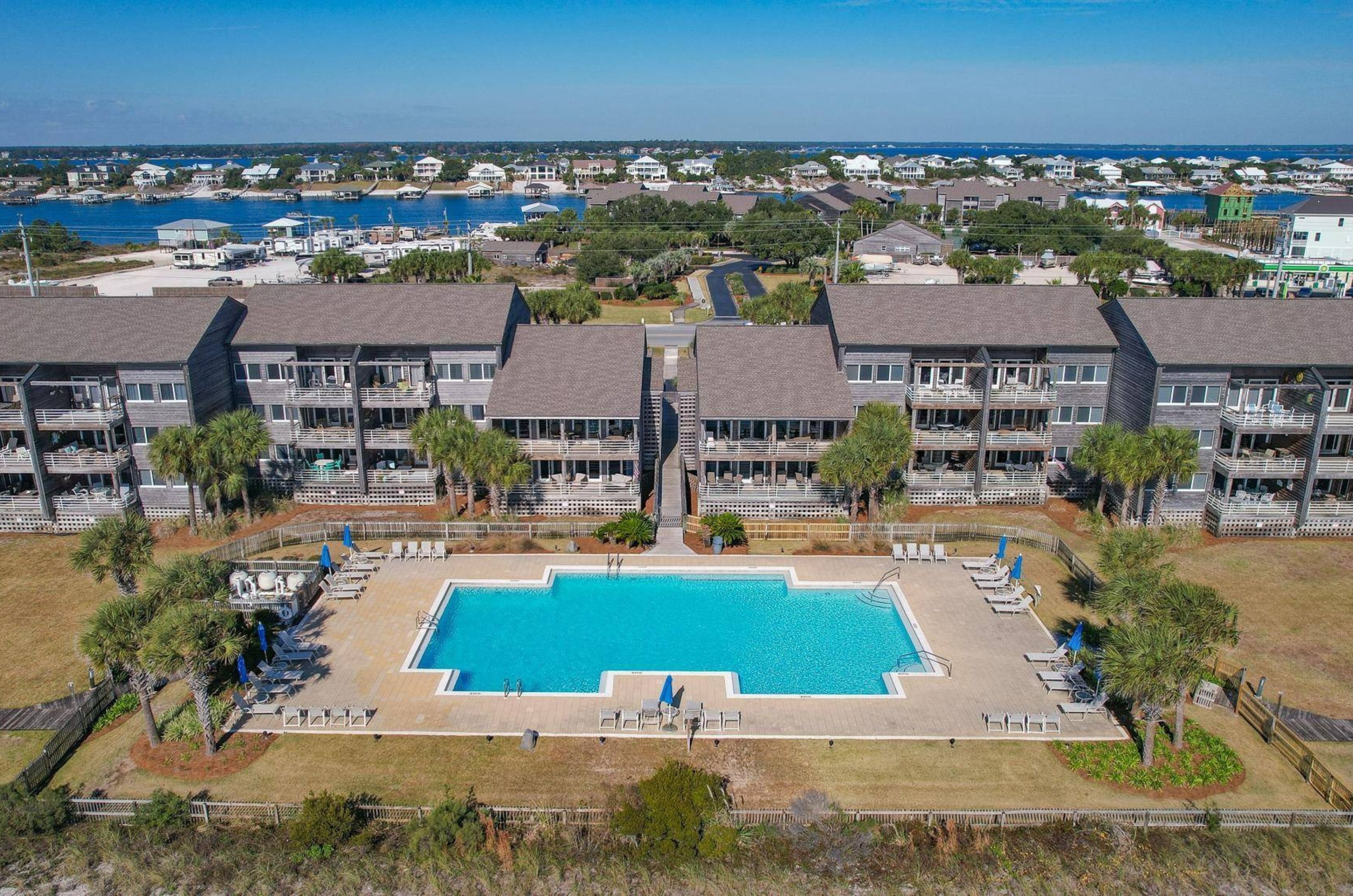 Aerial view of the swimming pool and condominiums at Needle Rush Point 