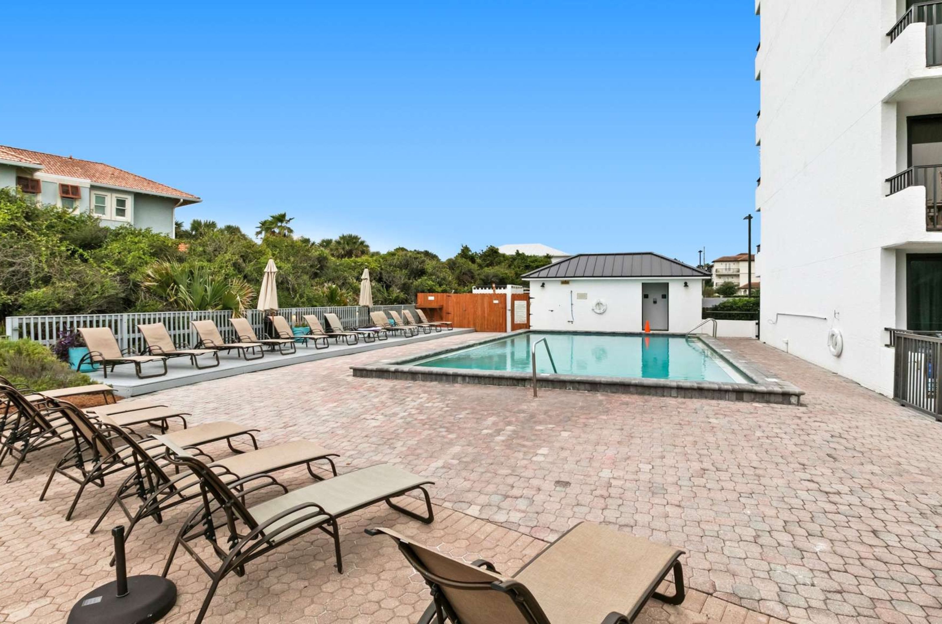 The outdoor swimming pool and pool deck at One Seagrove Place on Highway 30A in Florida 