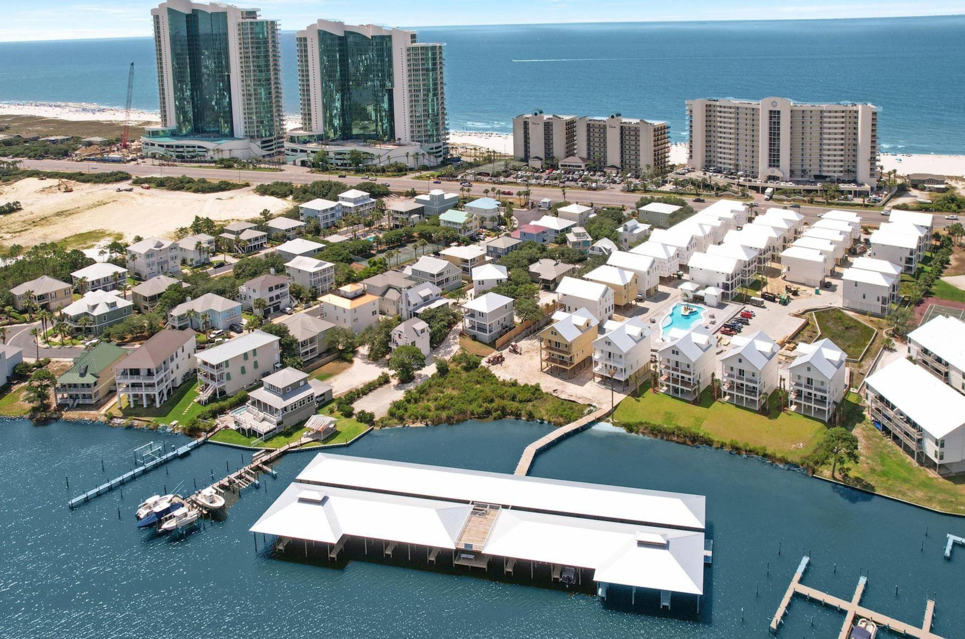 Aerial view of Orange Beach with high rises and rental homes