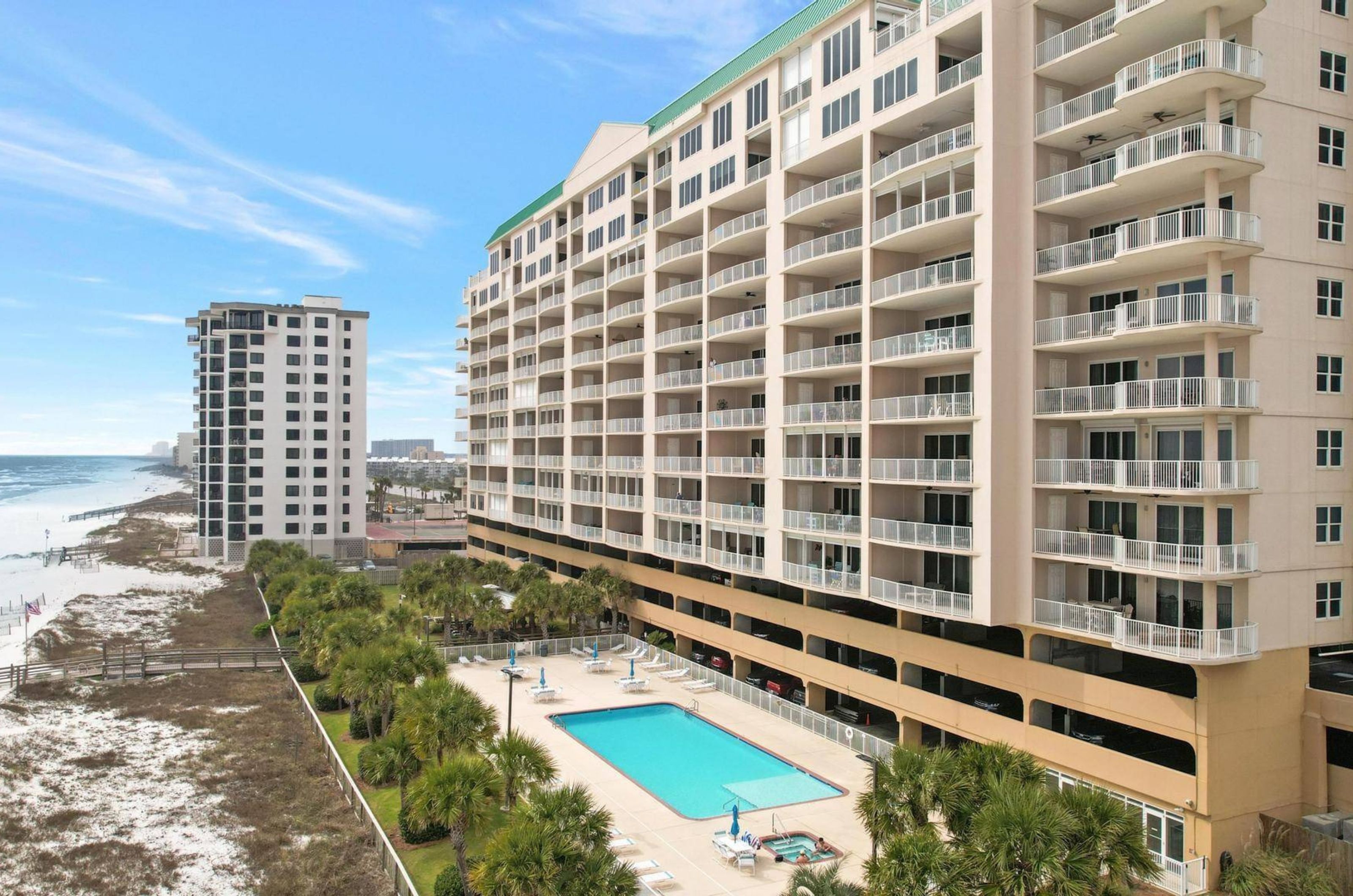 Aerial view of Regency Isle with the pool out front in Orange Beach Alabama 