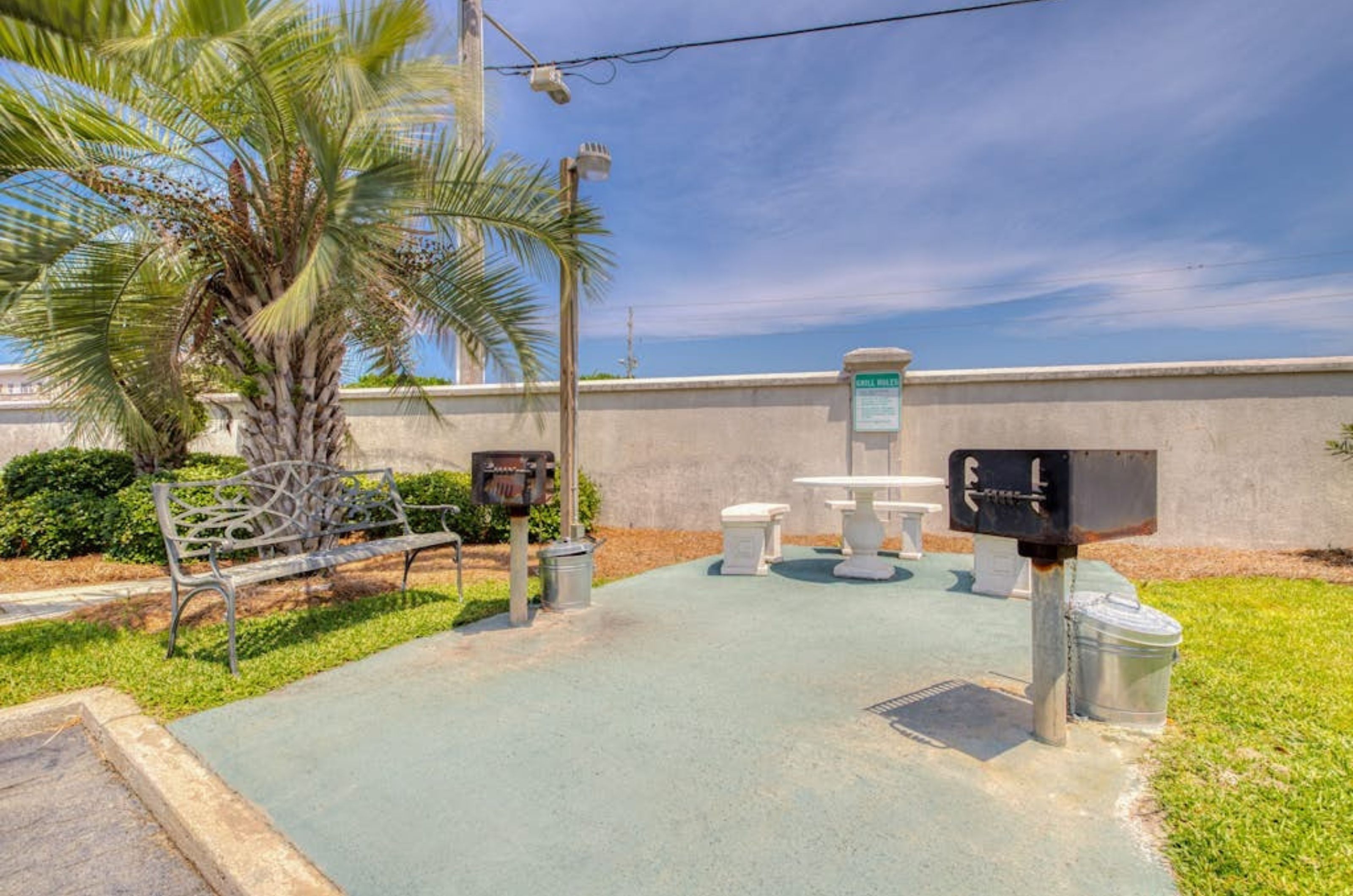 The outdoor charcoal grills next to the beach at Palm Beach Condos in Orange Beach Alabama 