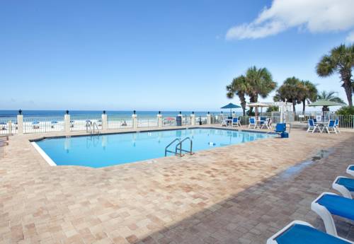 Huge pool deck surrounds the sparkling pool at Beachside Resort in Panama City Beach FL 