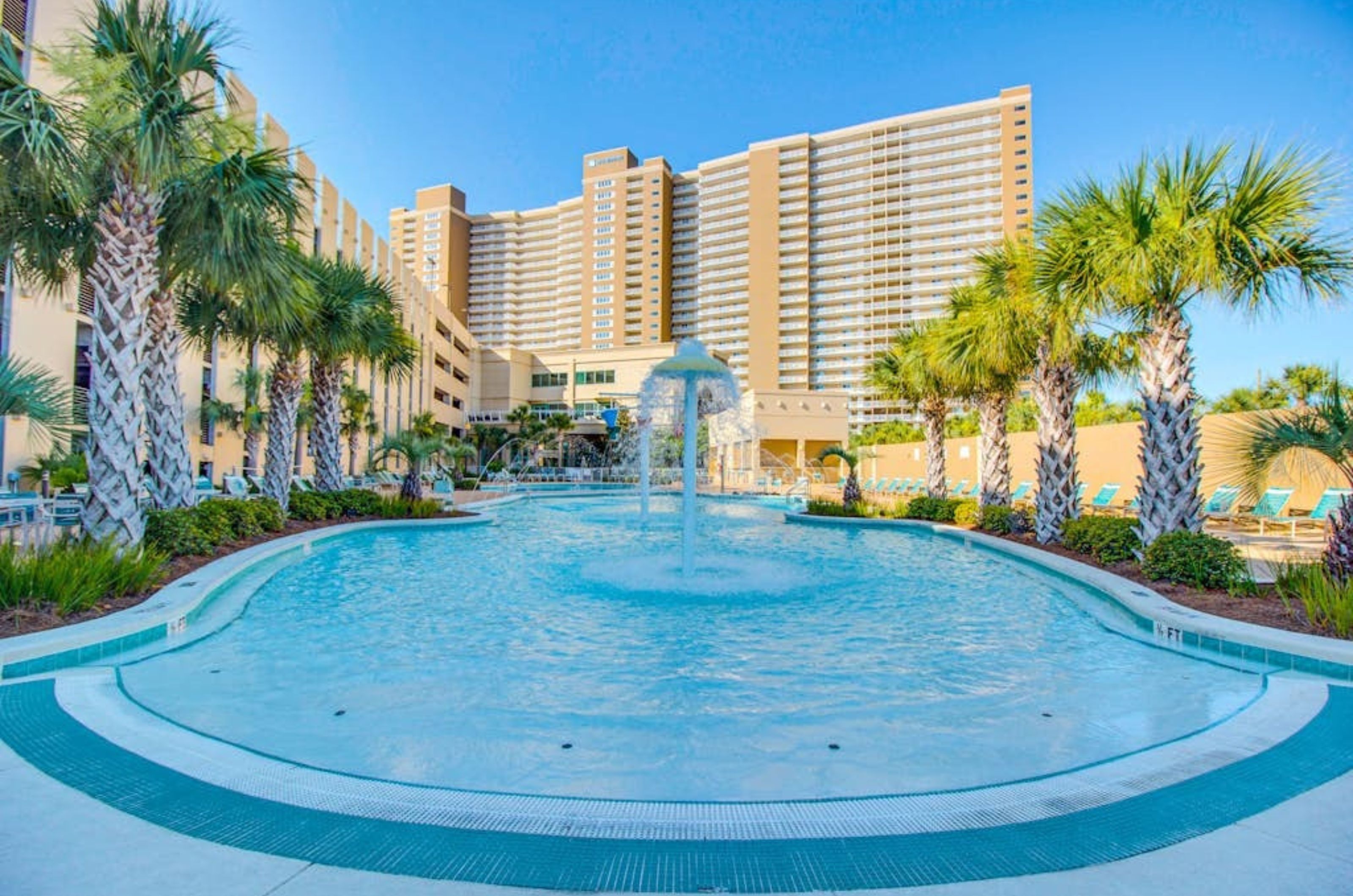 The outdoor swimming pool in front of Emerald Beach Resort in Panama City Beach Florida 