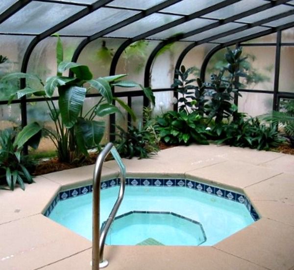 Indoor hot tub and greenery at Pelican Walk Panama City