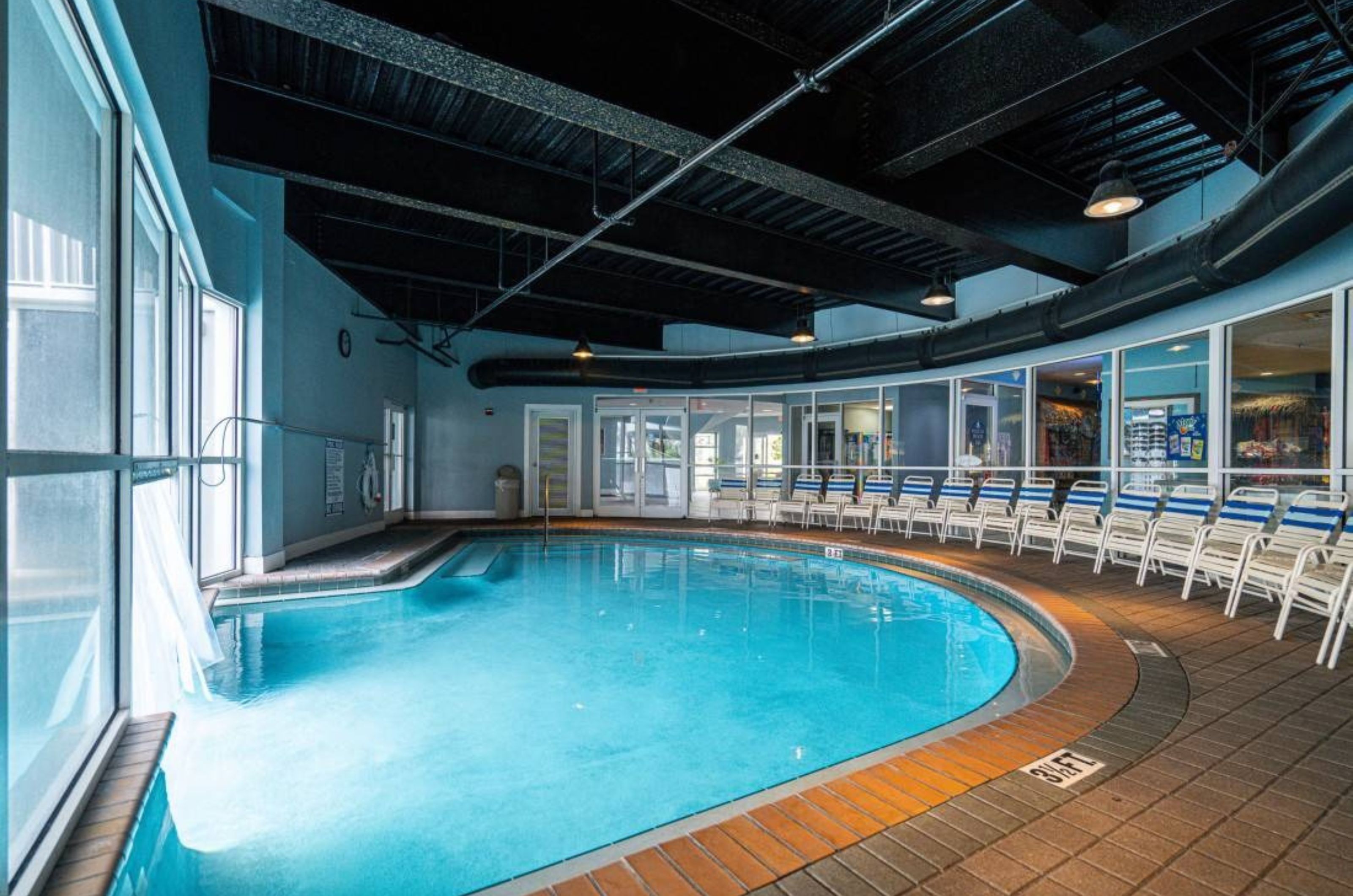 The indoor section of the indoor/outdoor swimming pool at Pelican Beach Resort in Destin Florida 