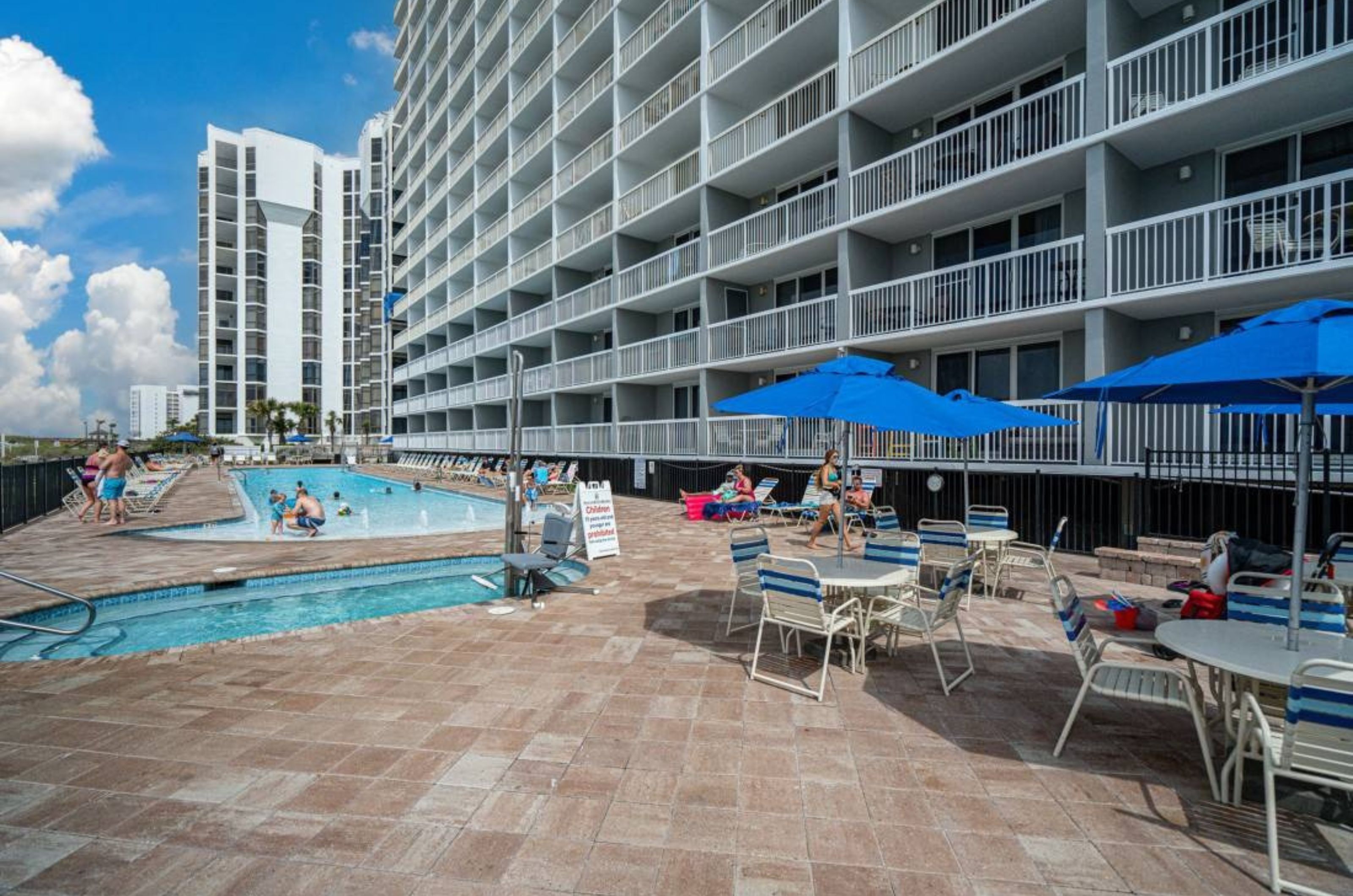 The beachfront facade of Pelican Beach Resort with balconies in front of each unit