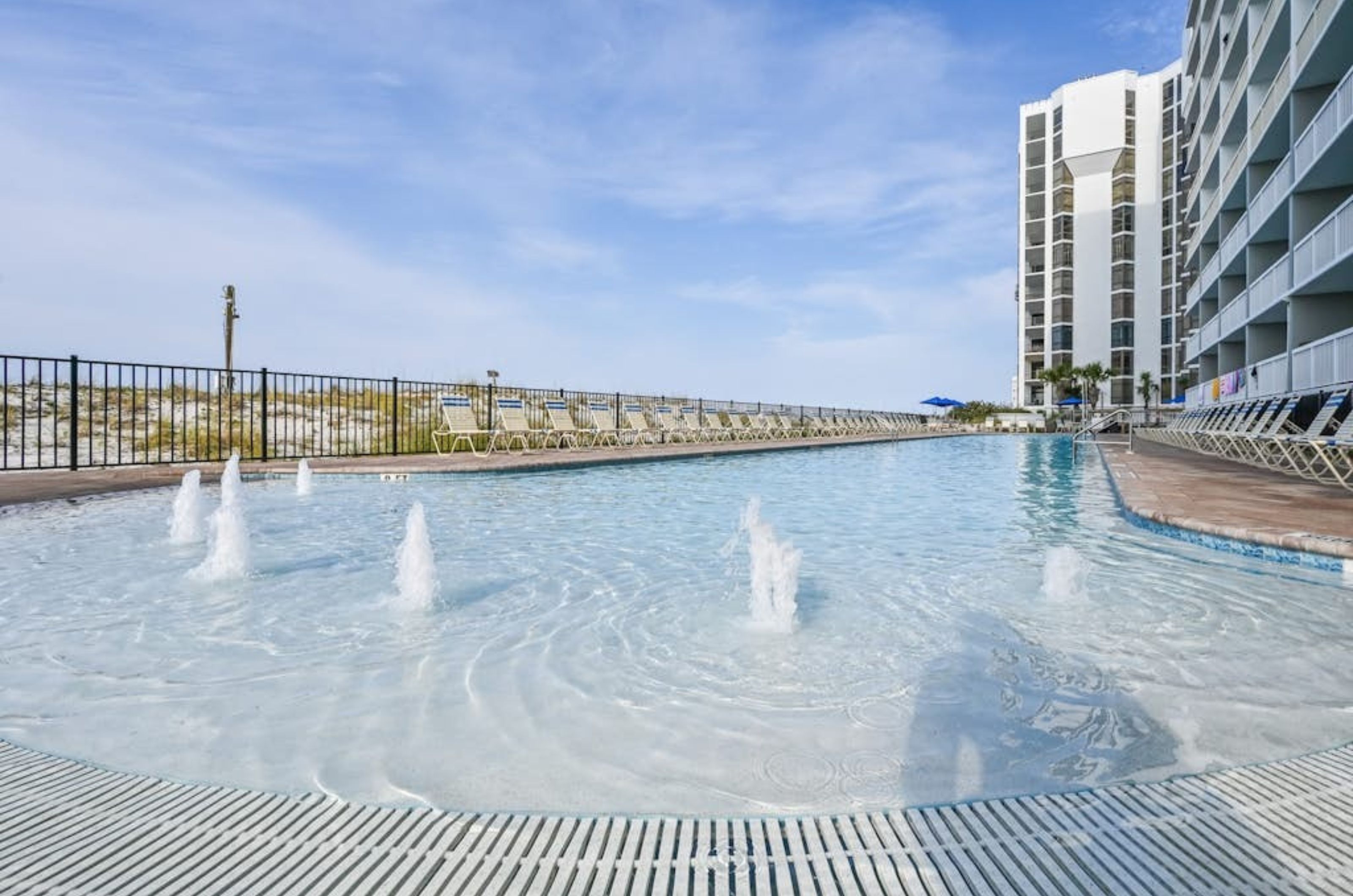 The zero-entry swimming pool in front of Pelican Beach Resort in Destin Florida 