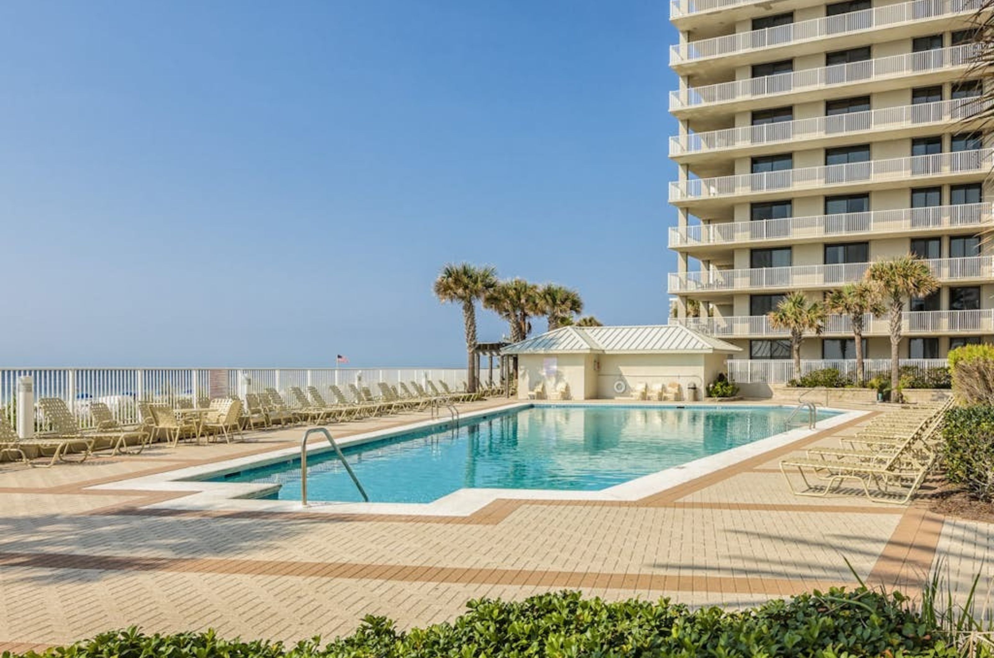 The outdoor swimming pool next to the beach at Pelican Pointe in Orange Beach Alabama 