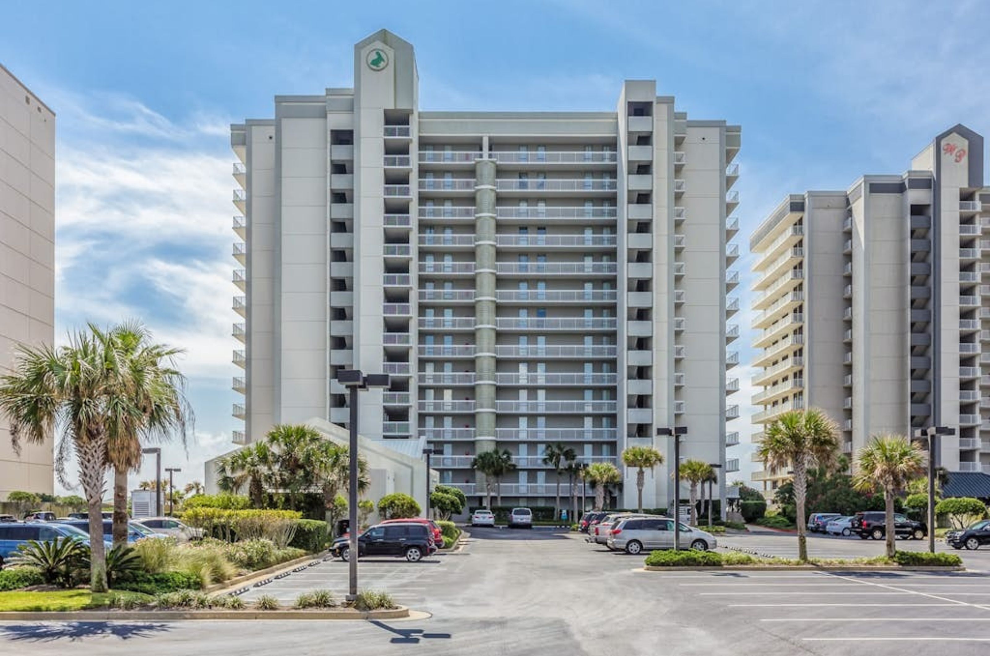 View from the the street of Pelican Pointe with the parking lot in front 