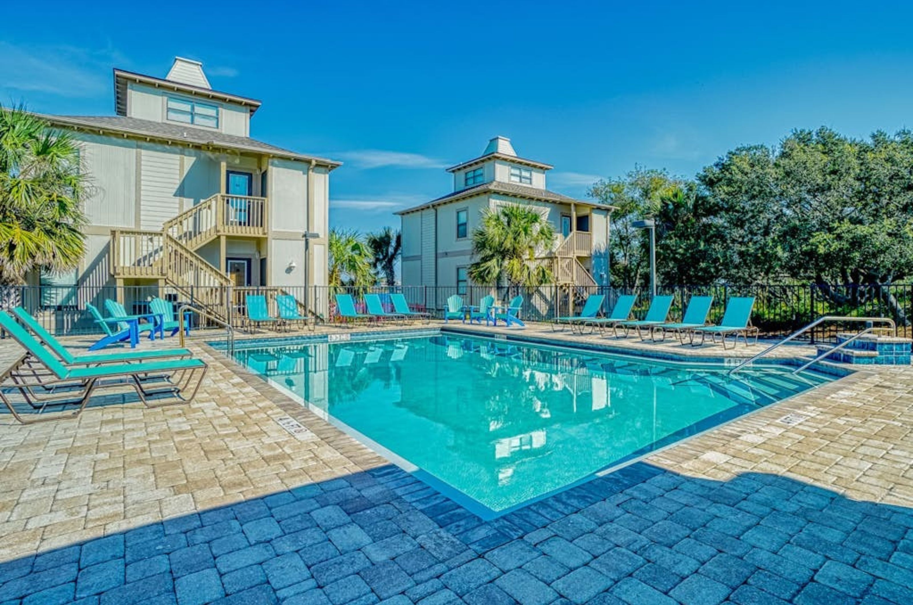 The outdoor swimming pool in front of townhomes at Molokai Villas in Perdido Key Florida 