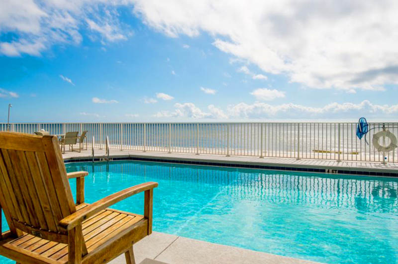 You will relax poolside and watch the waves role in at Windemere Condominiums in Perdido Key Florida