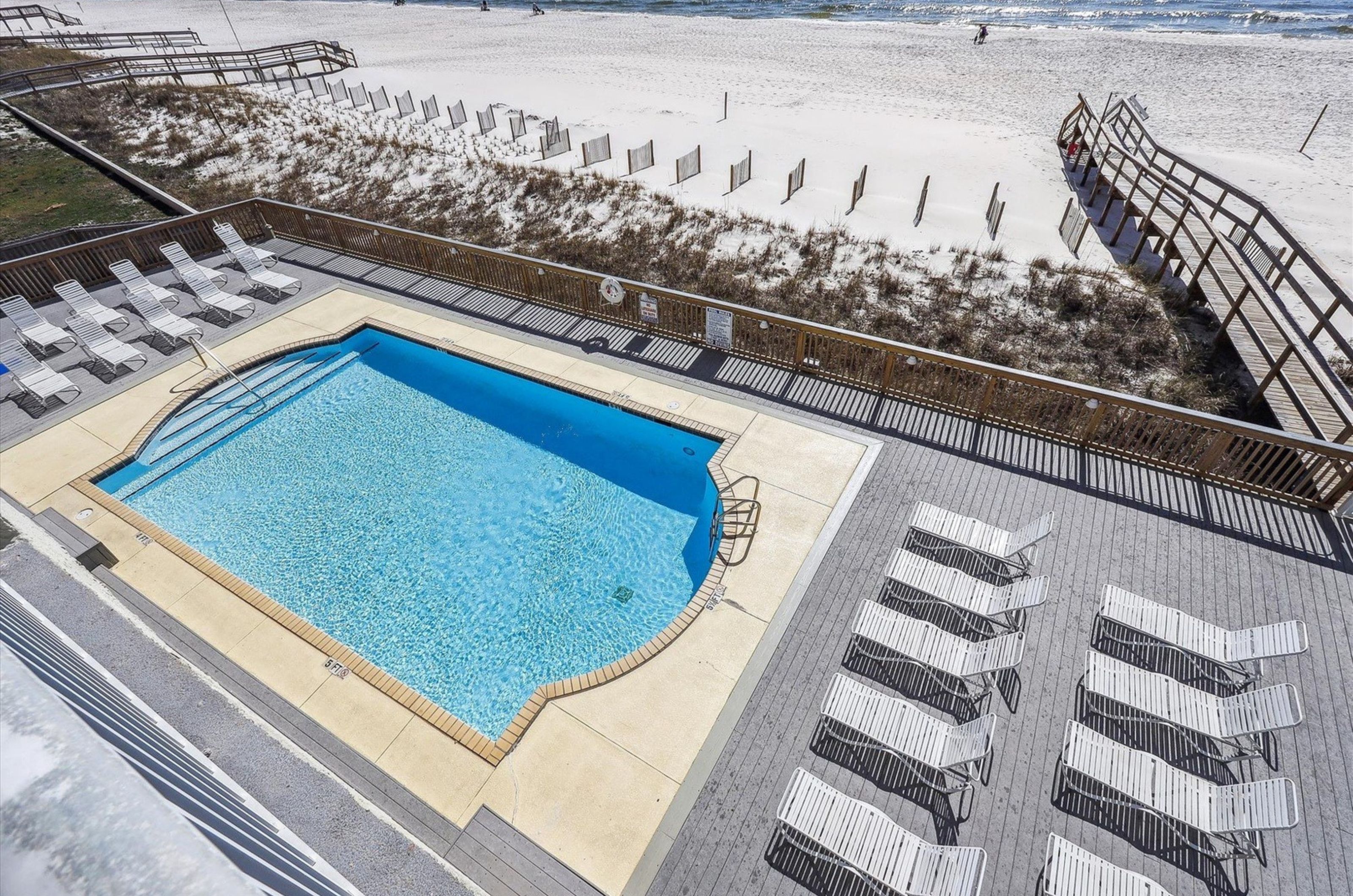 Aerial view of the pool pool deck and wooden boardwalk at Perdido Skye in Perdido Key Florida