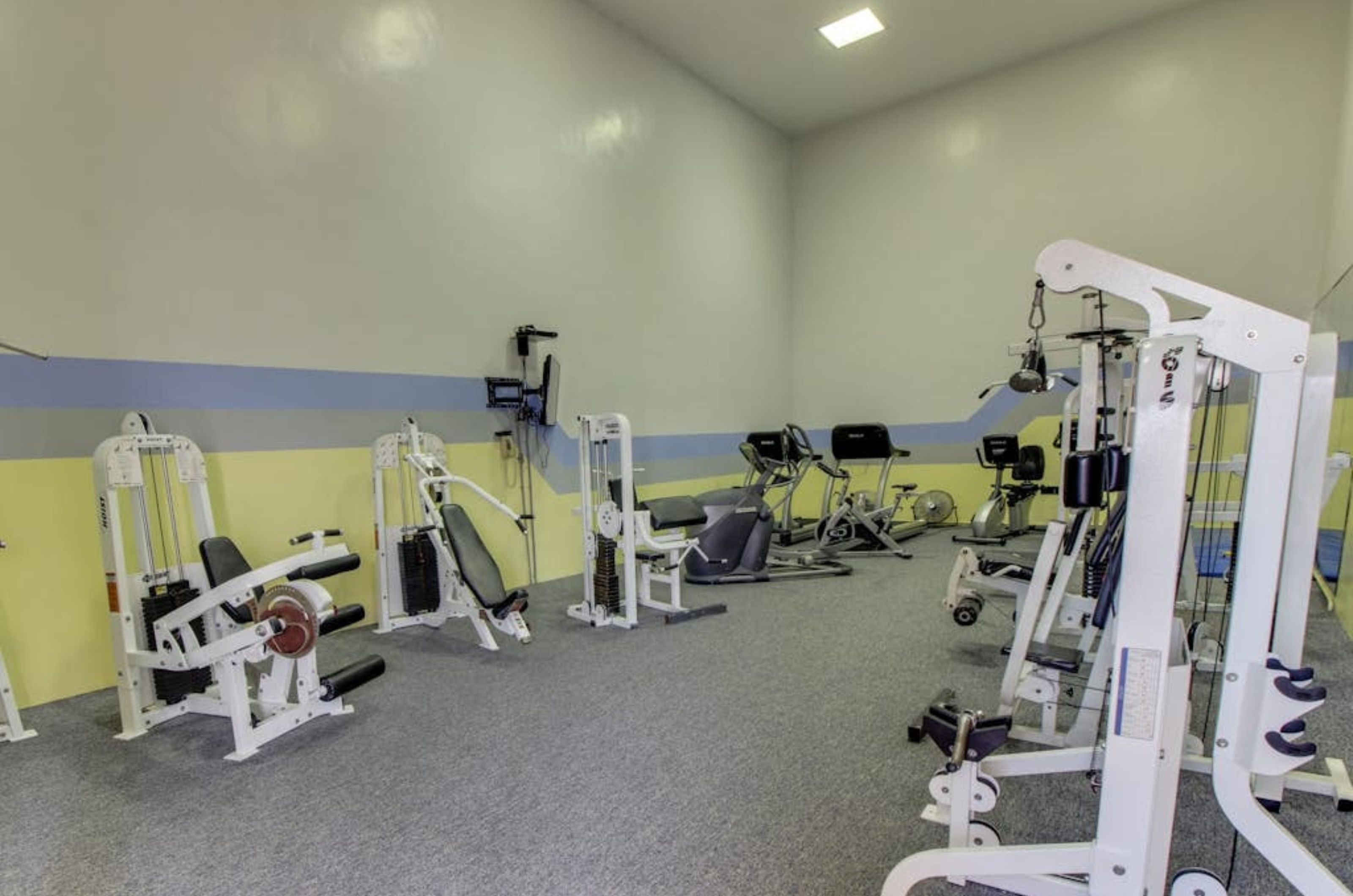 Strength equipment in the gym at Phoenix I in Orange Beach Alabama